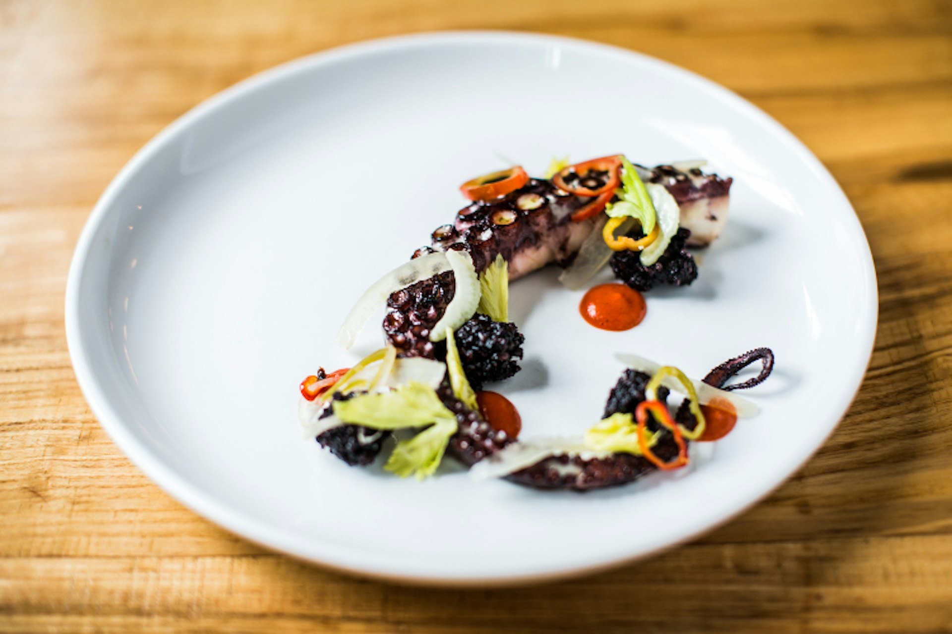 Octopus, hominy, tomatillo, radish and lime at Rolf and Daughters. Image by Andea Behrends / courtesy of Rolf and Daughters