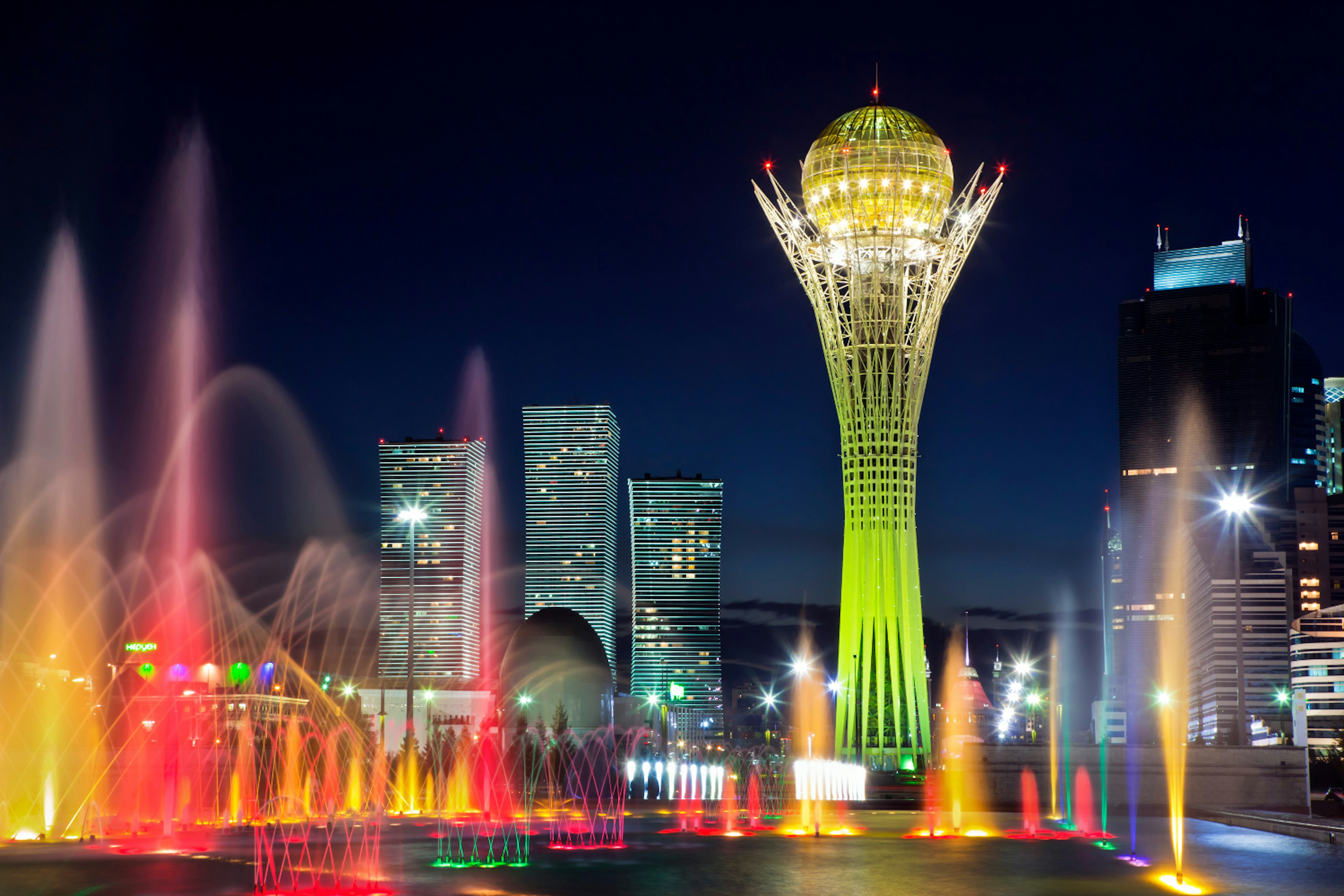 Astana's futuristic skyline is most beautiful when lit up at night. Image by Rush Eastham & Max Paoli / Getty