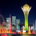 Astana's futuristic skyline is most beautiful when lit up at night. Image by Rush Eastham & Max Paoli / Getty