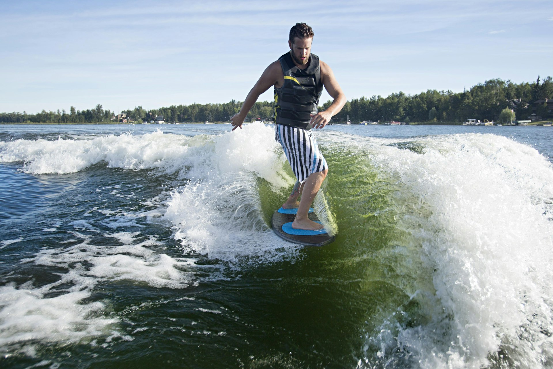Wakesurfing relies on the wake created by a speedboat’s hull. Image by Aaron Black / Getty