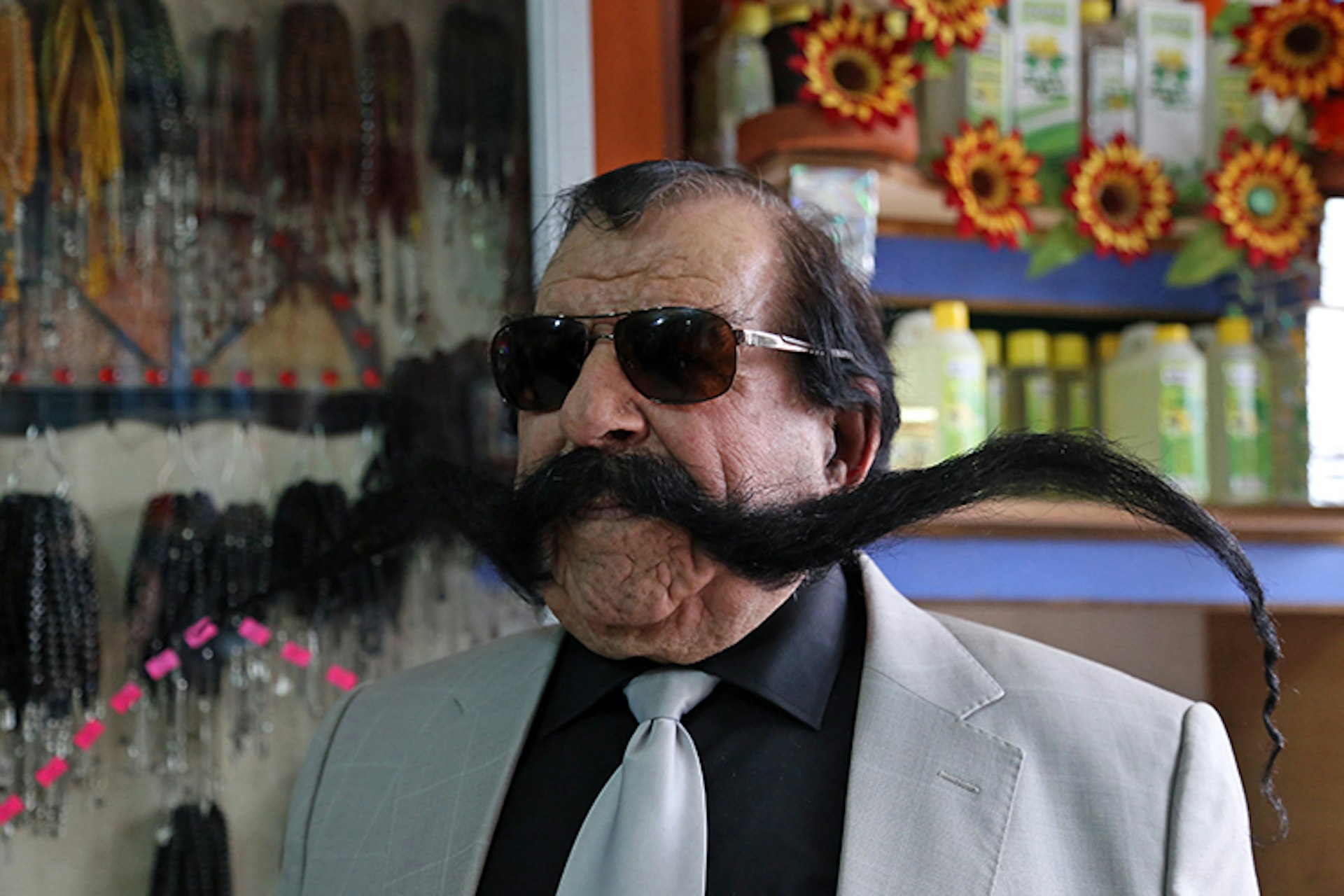 Turkish hairdresser Haci Kilic of Turkey poses with his 1.5 meter long mustache