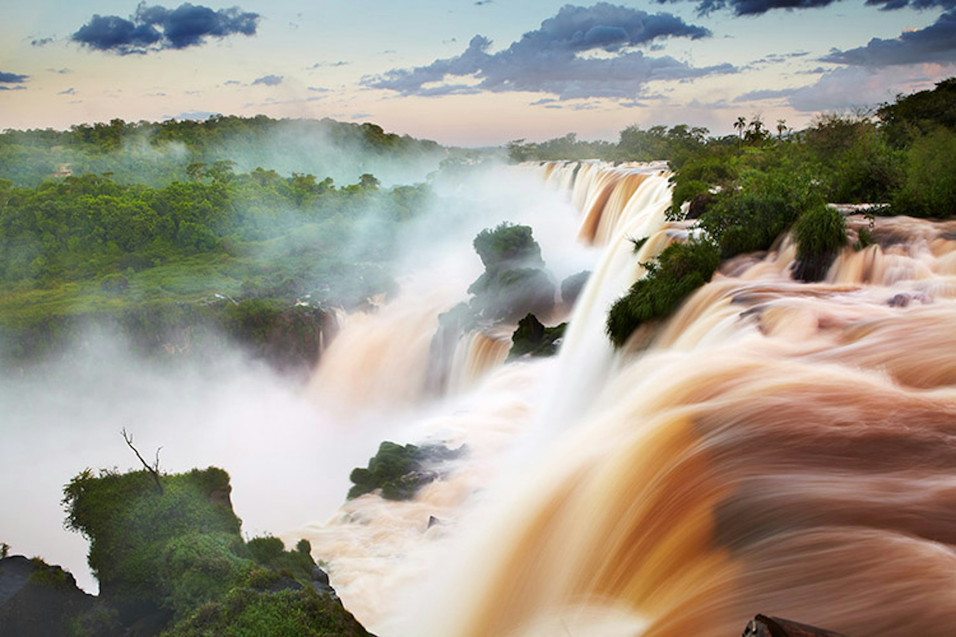 Water pouring over Iguazu Falls.