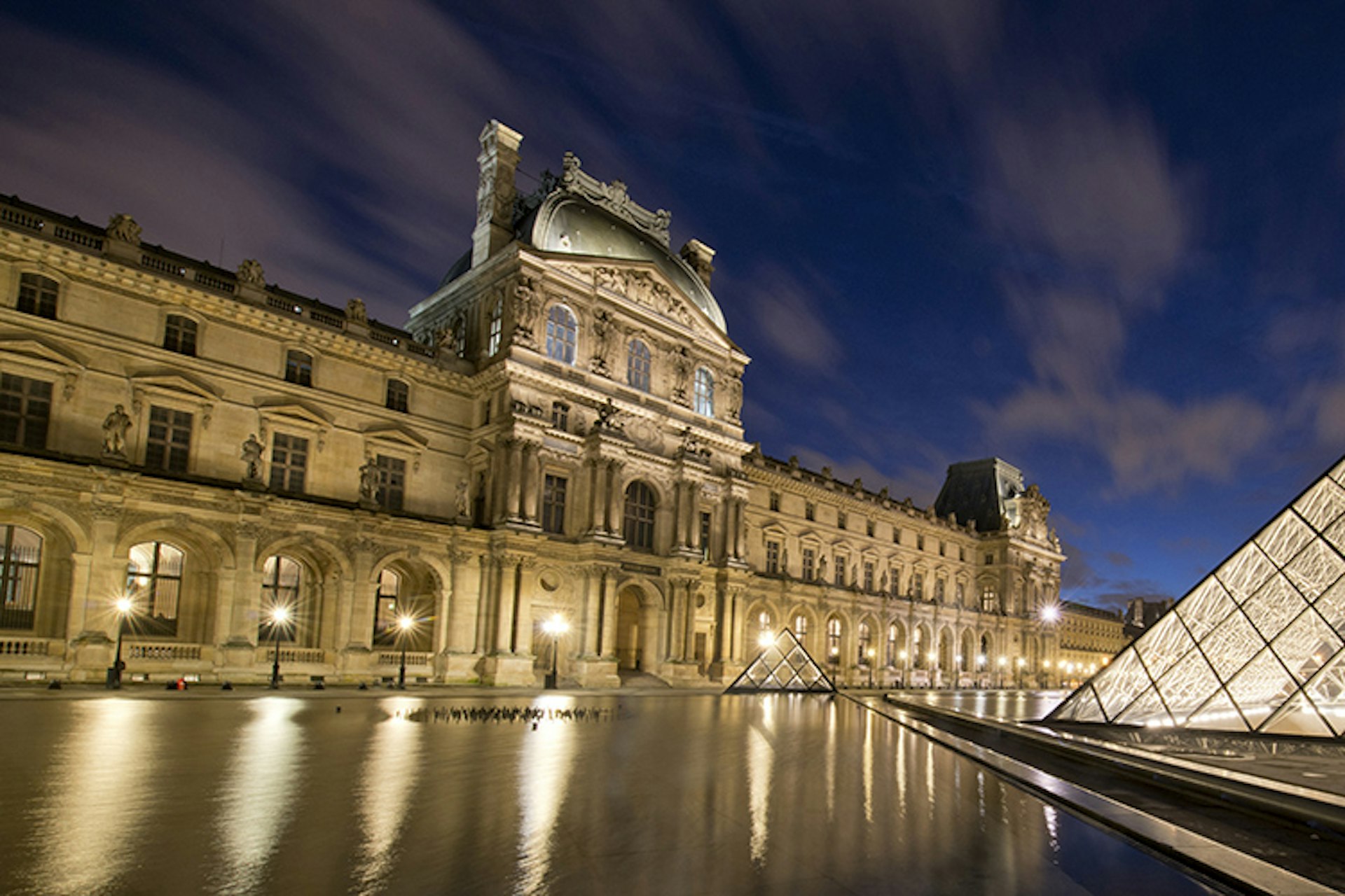 Central courtyard of Louvre at dusk.