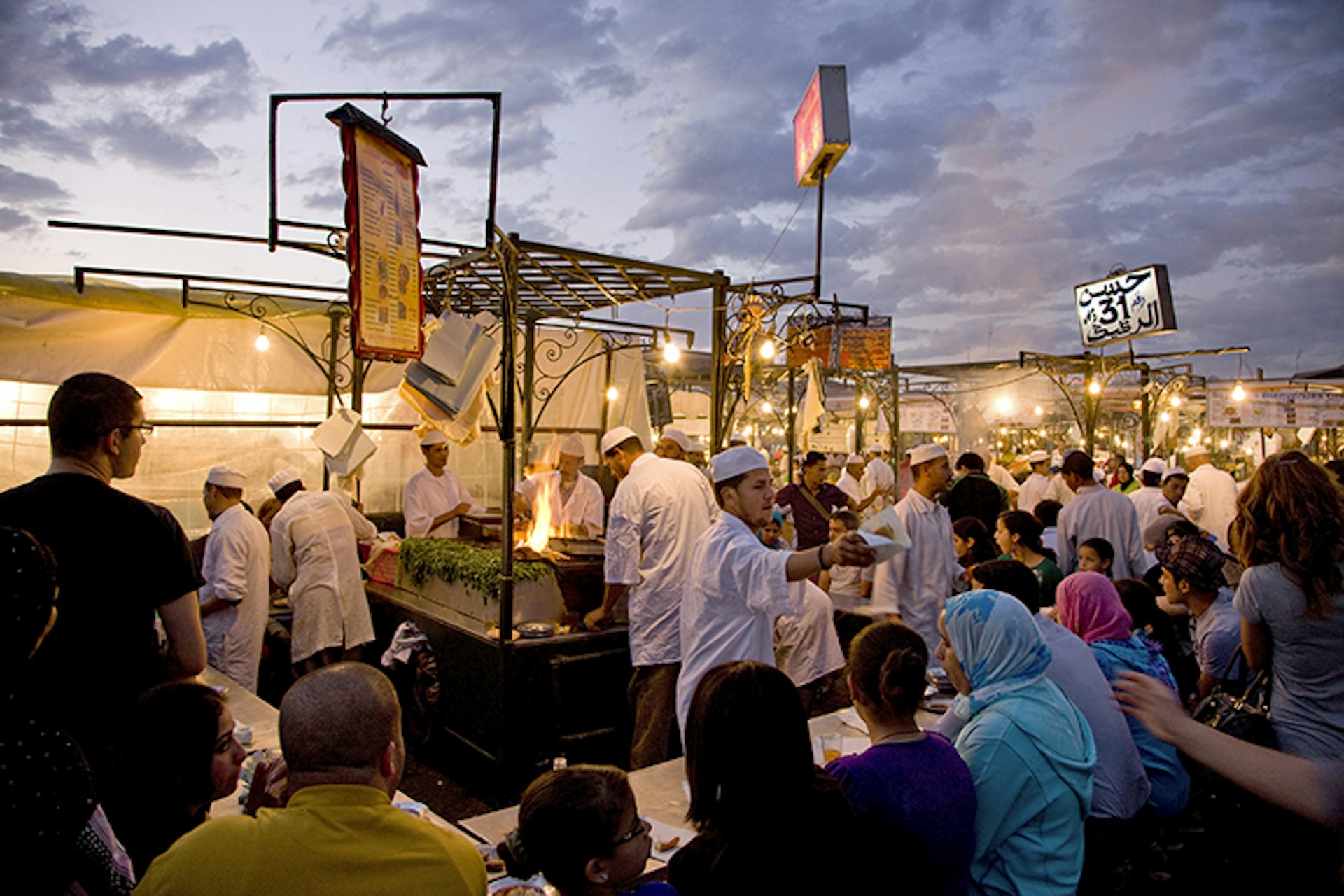 Busy food stall at Djemaa el-Fna market.