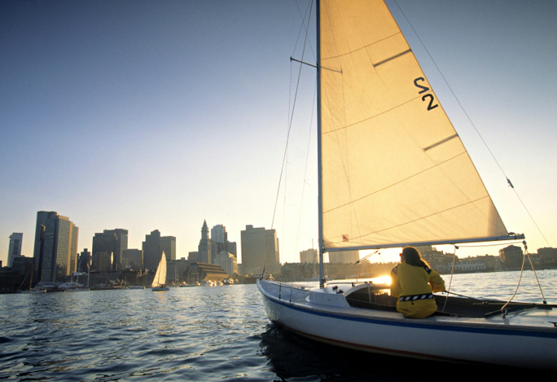 Sailing around the Boston harbor. Image by Walter Bibikow / AWL Images / Getty Images 