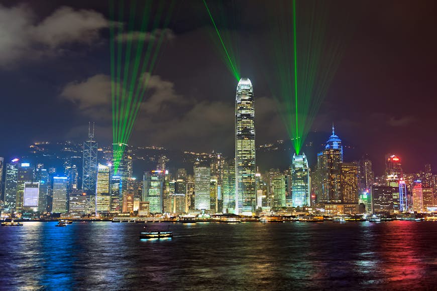 Best views of the Symphony of Lights are from Tsim Sha Tsui promenade. Image by Pavliha / Getty
