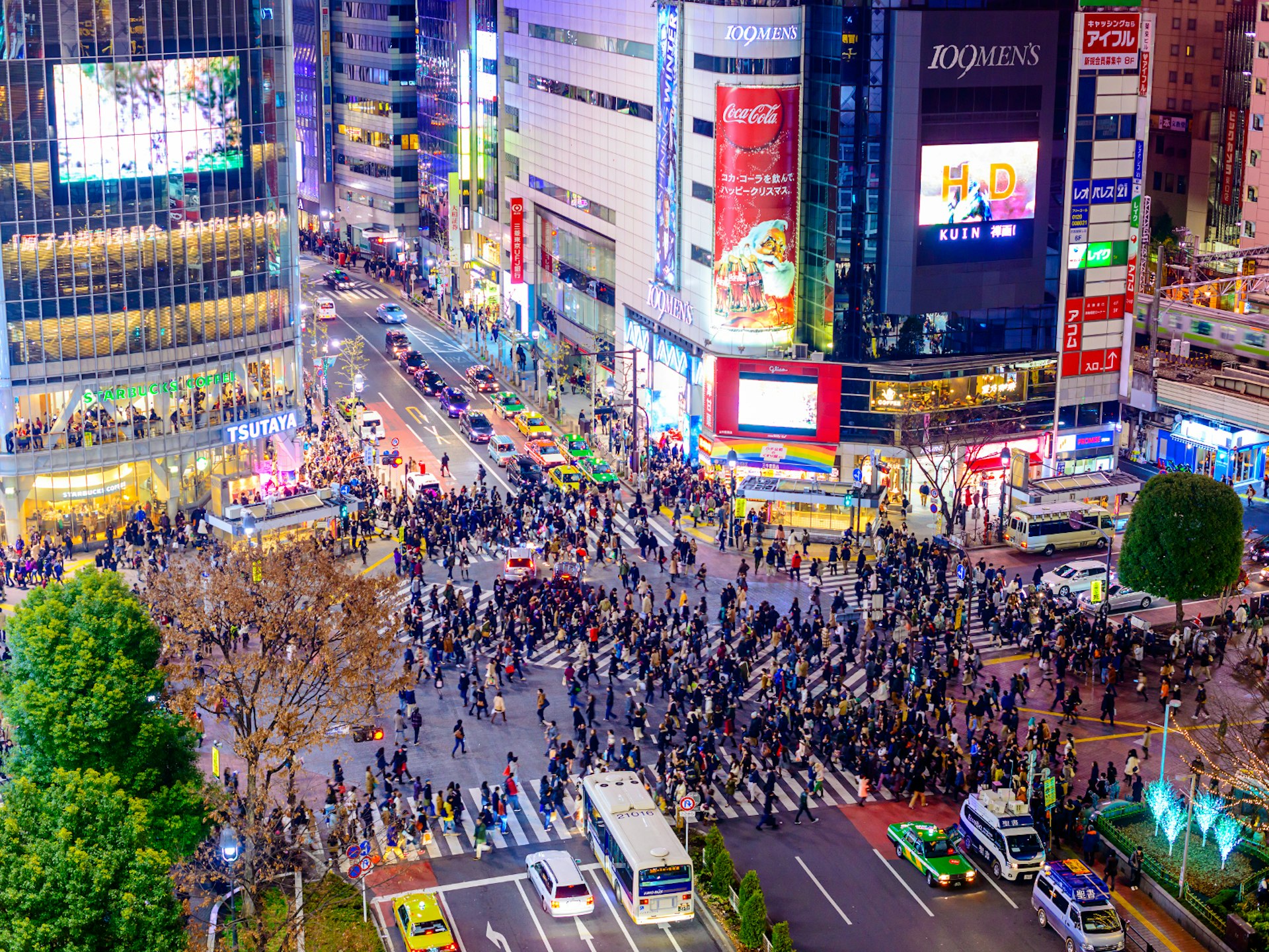 Crowds of people crossing Tokyo's Shibuya crossing