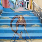 Whimsical giraffe mural in Songwol-dong Fairytale Village. Image by Trent Holden / Lonely Planet
