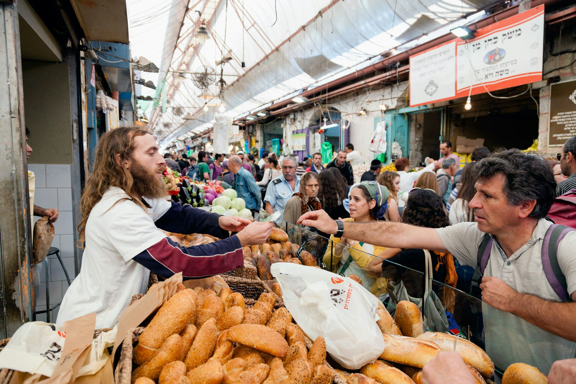 People shopping at Mahane Yehuda, famous market in Jerusalem © Alexey Stiop / Shutterstock