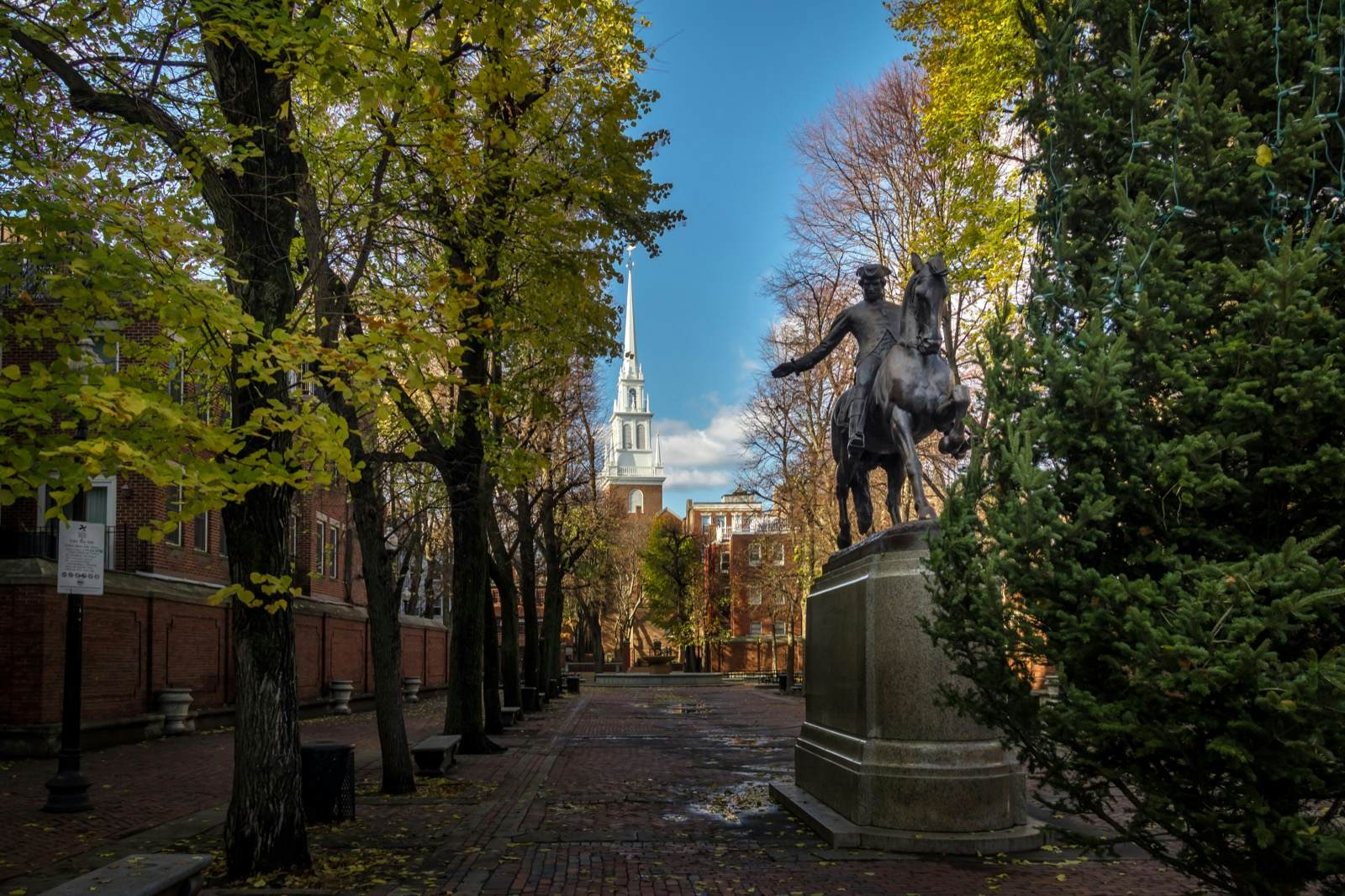 A statue of a man riding a horse is seen on a cobblestone walkway along the freedom trail in Boston. It's a major spot of history in the United States.