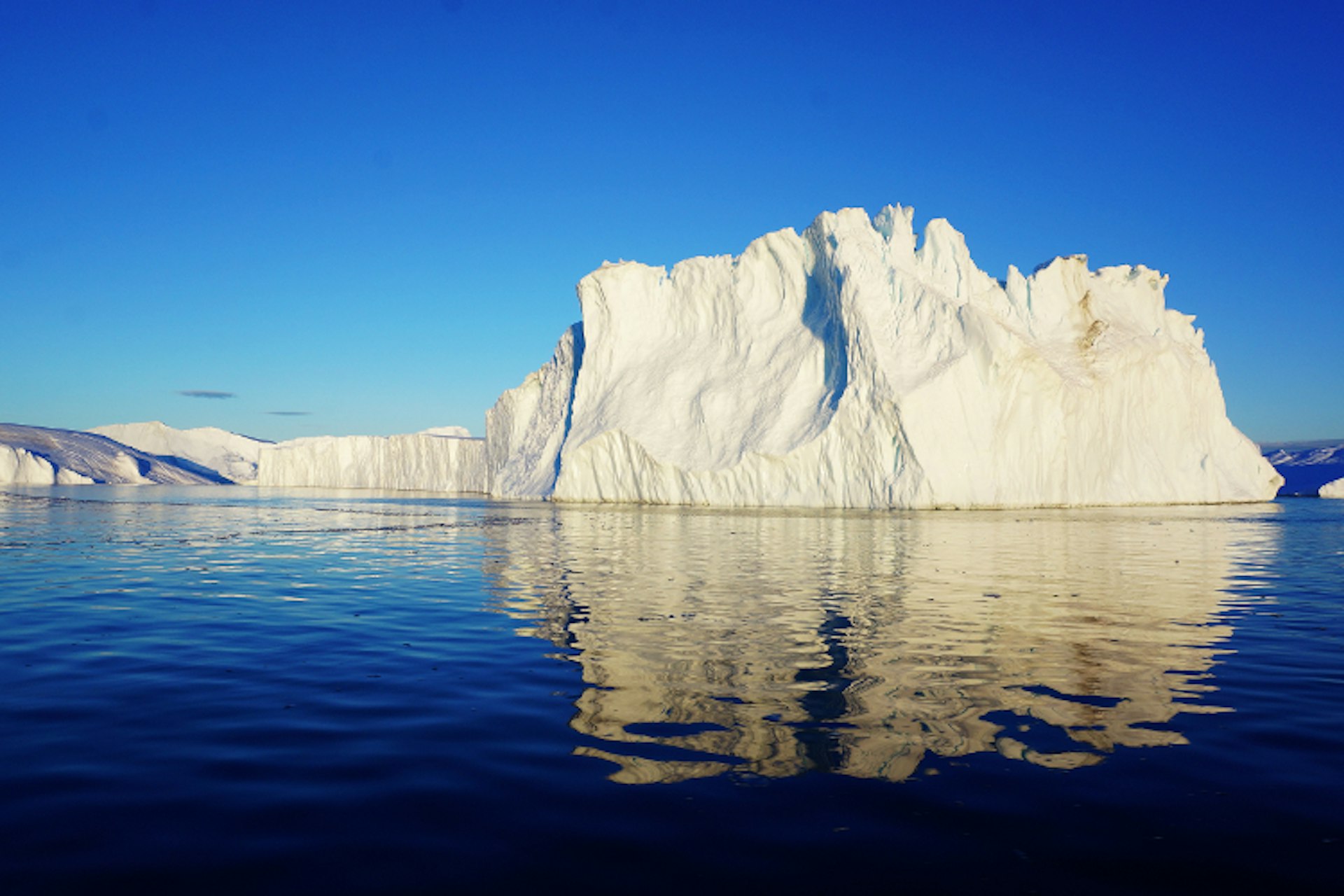 Enormous iceberg bobbing off the shore from Ilulissat-750-cs