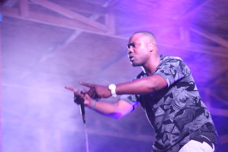 South African rapper Reason brought the crowd into a frenzy. Image by Nick Ray / Lonely Planet 