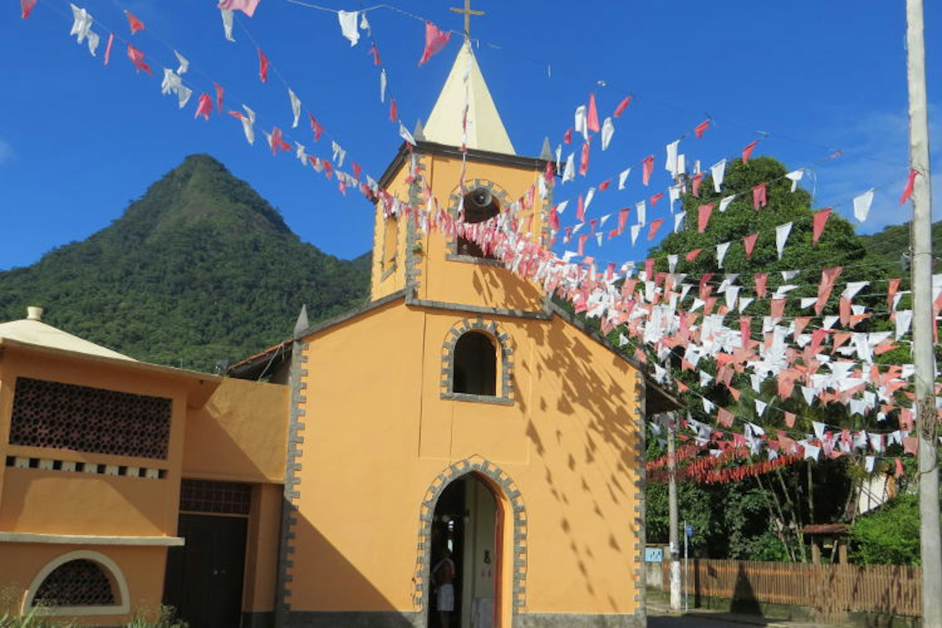 Town church with pre-Carnaval decorations, Vila do Abraão. Image by Gregor Clark / Lonely Planet