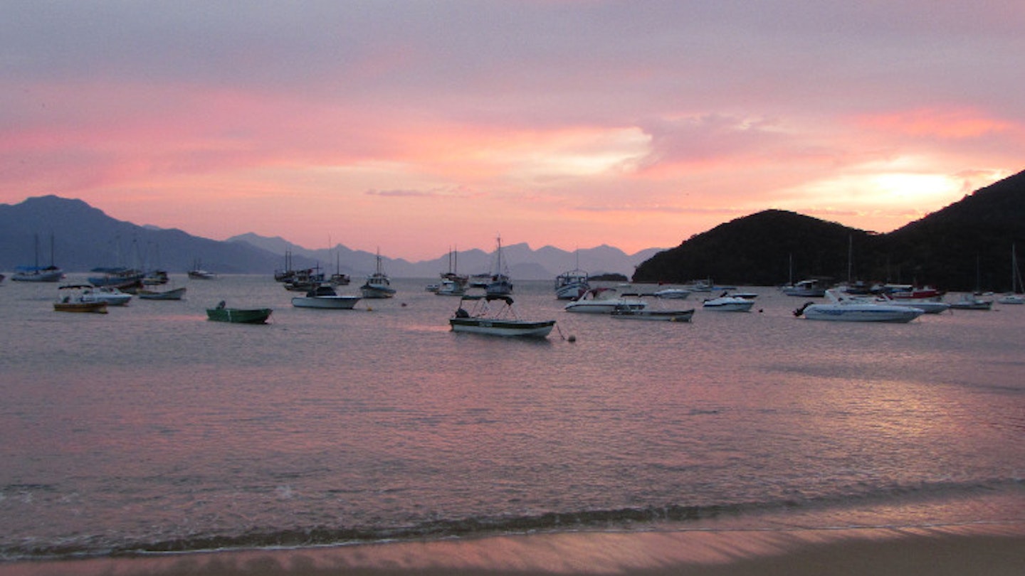Sunrise from Praia do Canto, Vila do Abraão, Ilha Grande. Image by Gregor Clark / Lonely Planet