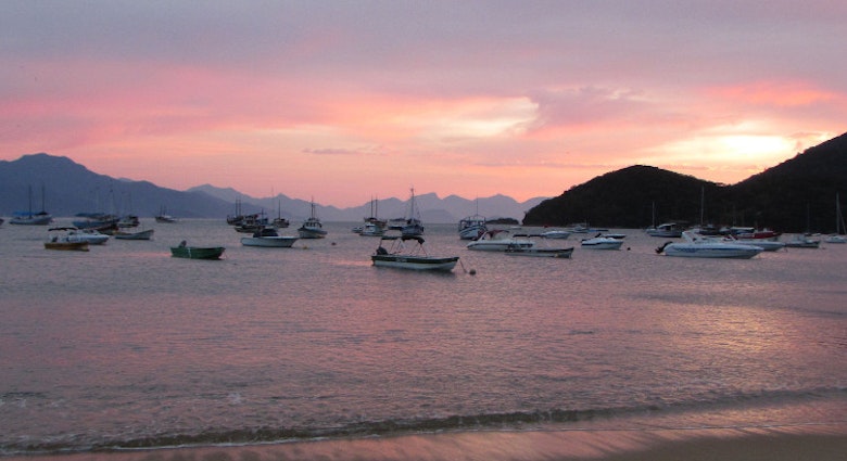 Sunrise from Praia do Canto, Vila do Abraão, Ilha Grande. Image by Gregor Clark / Lonely Planet