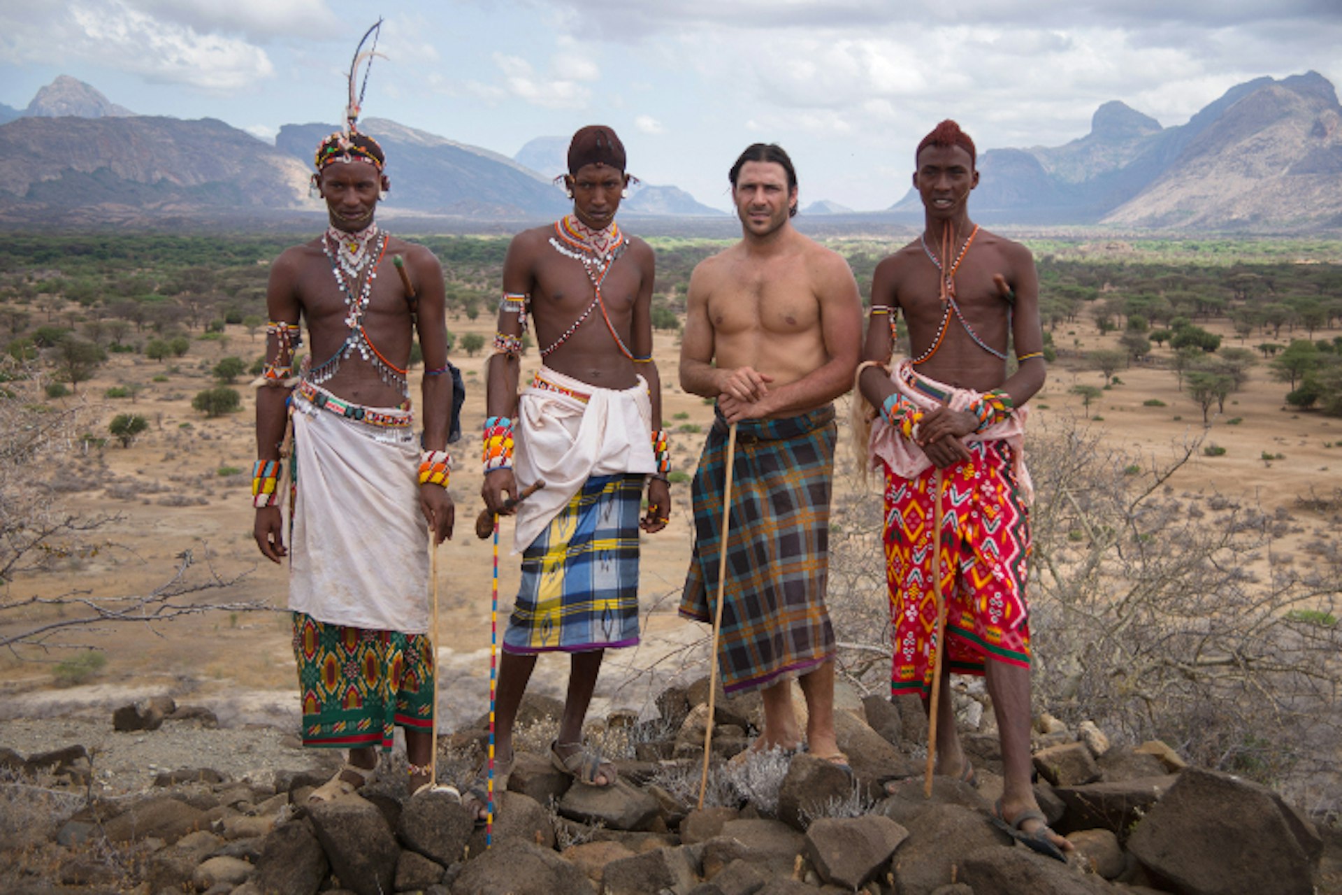 Mpagas, Kenya: Hazen Audel standing with three Samburu warriors. (Photo Credit: National Geographic Channels/Alex Parkinson)