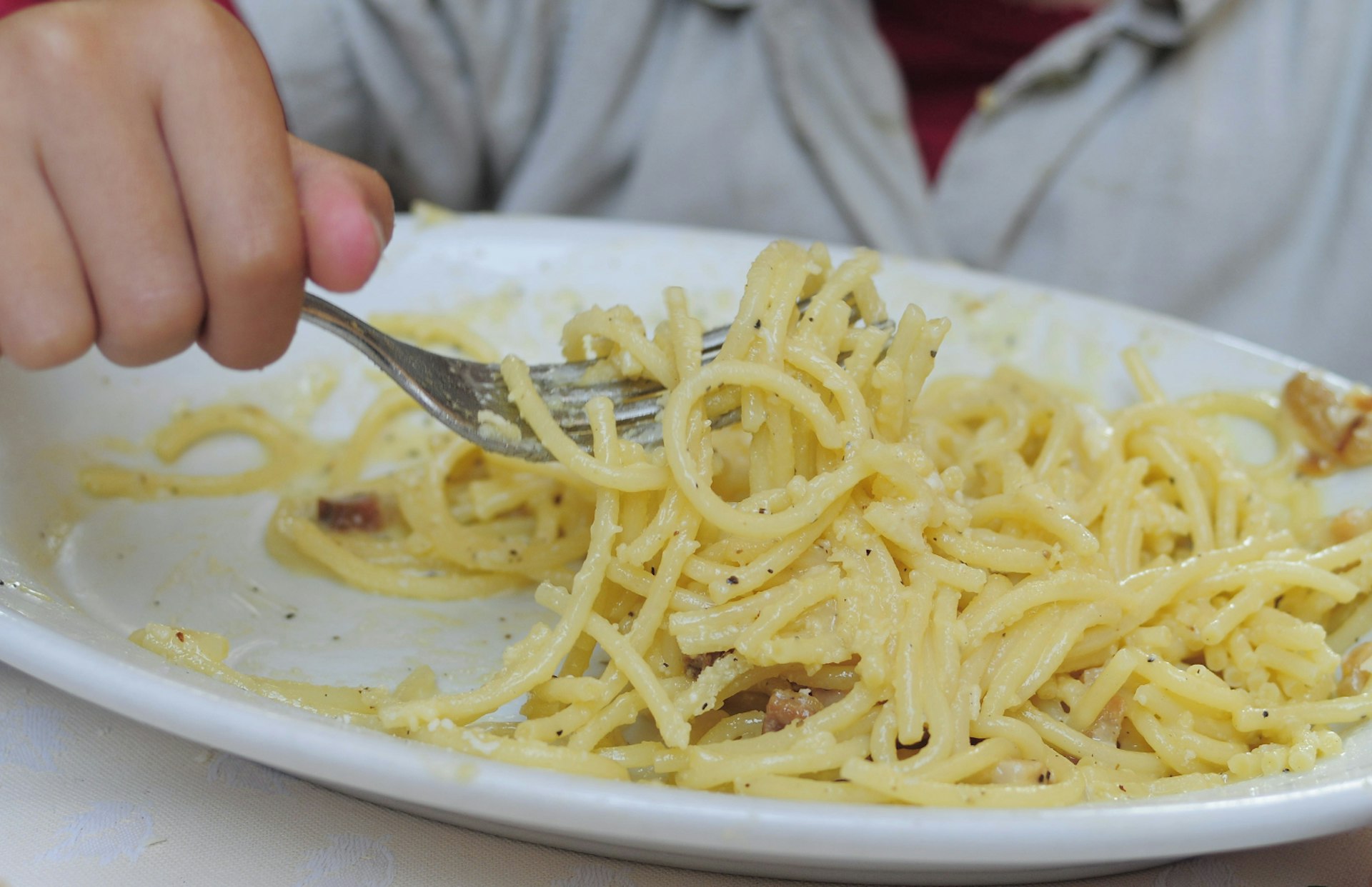 Tucking in to the Roman classic, spaghetti carbonara.