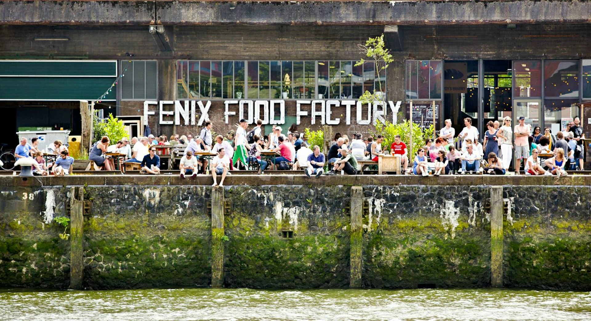 People enjoying the sun at the Fenix Food Factory in Katendrecht, Rotterdam