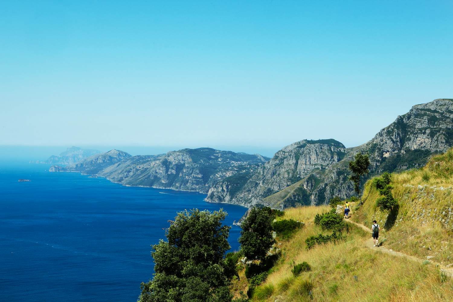 Hikers on Sentiero degli Dei (Path of the Gods), which provides incredible views of the Amalfi Coast and the island of Capri.