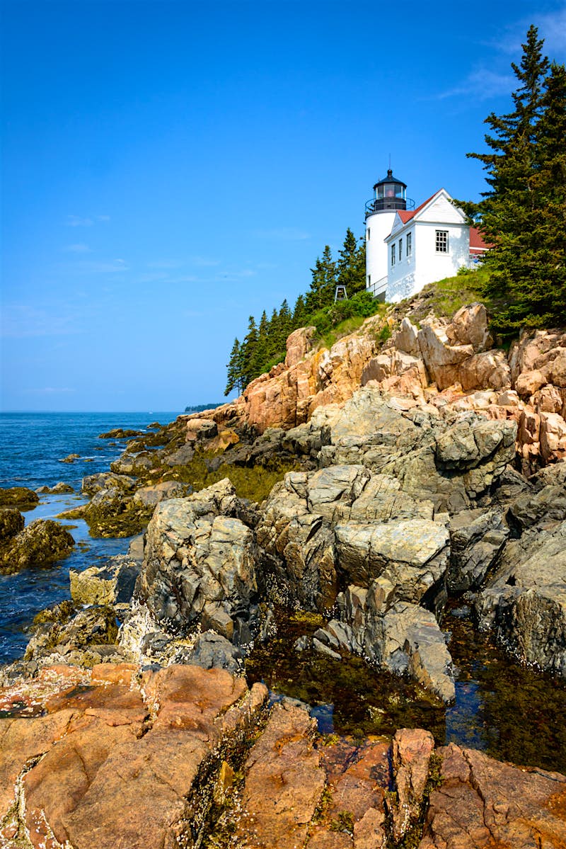 Features - shutterstockRF_304629407-ffbcb8ae3fad A lighthouse overlooking the rocky coastline of Acadia National Park; the USA's top 10 natural wonders