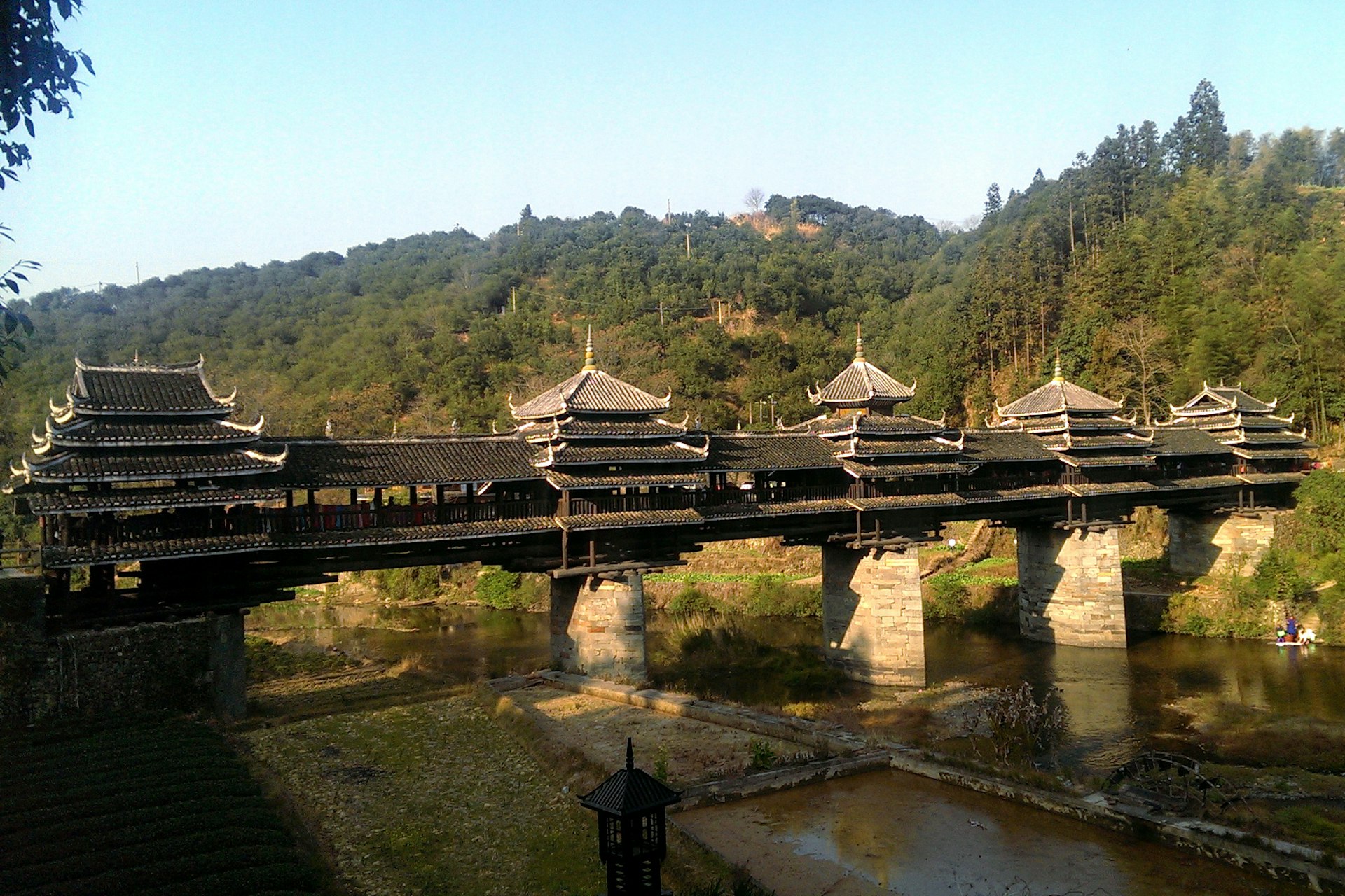 The magnificent Wind and Rain Bridge connects the Dong villages to the outside world. Image by Piera Chen / Lonely Planet