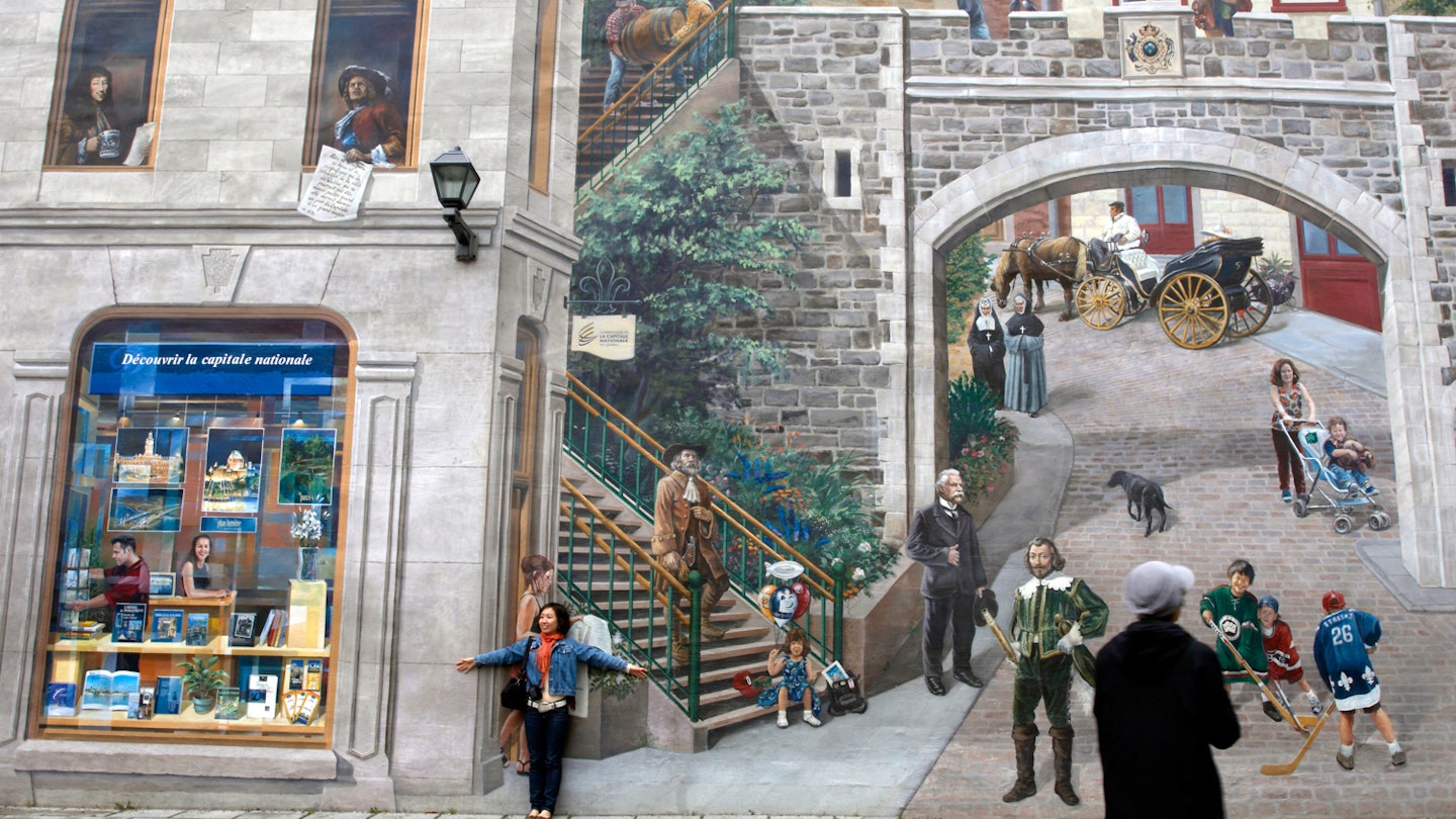 The Fresque des Québécois tells the story of Québec City’s history. Image by MANIN Richard / hemis.fr / Getty