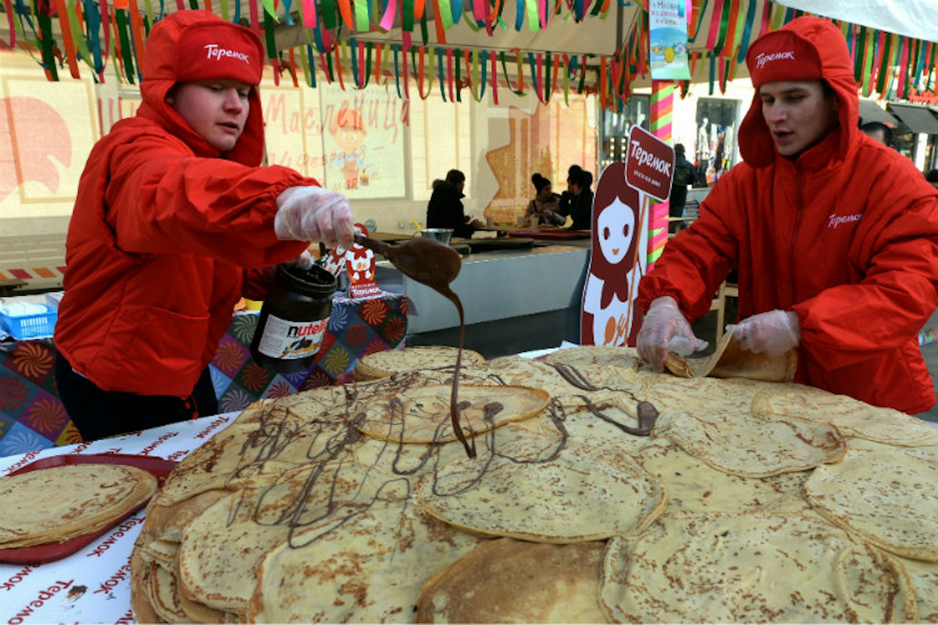 Say goodbye to winter and hello to a giant plate of pancakes for Maslenitsa in Moscow. Image by Vasily Maximov / AFP / Getty