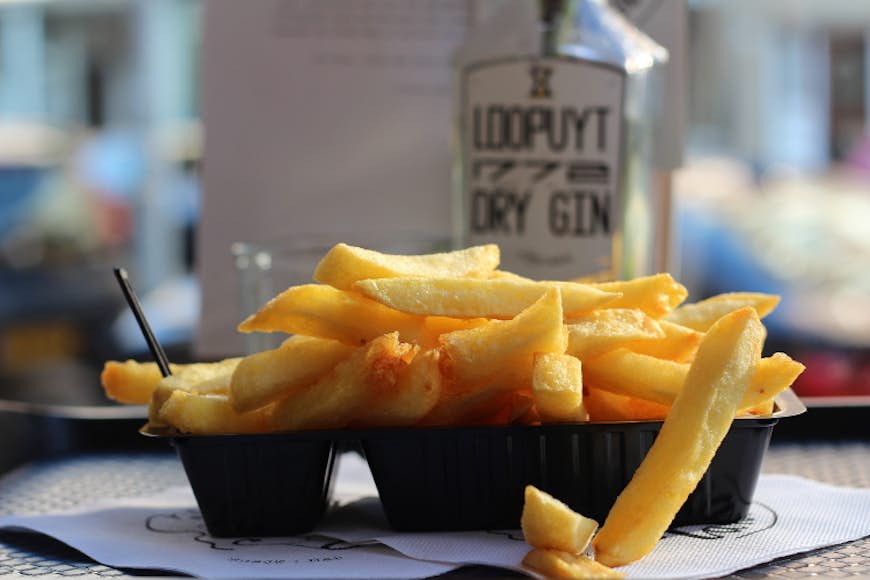 Snack on some frites washed down with gin at Tante Nel