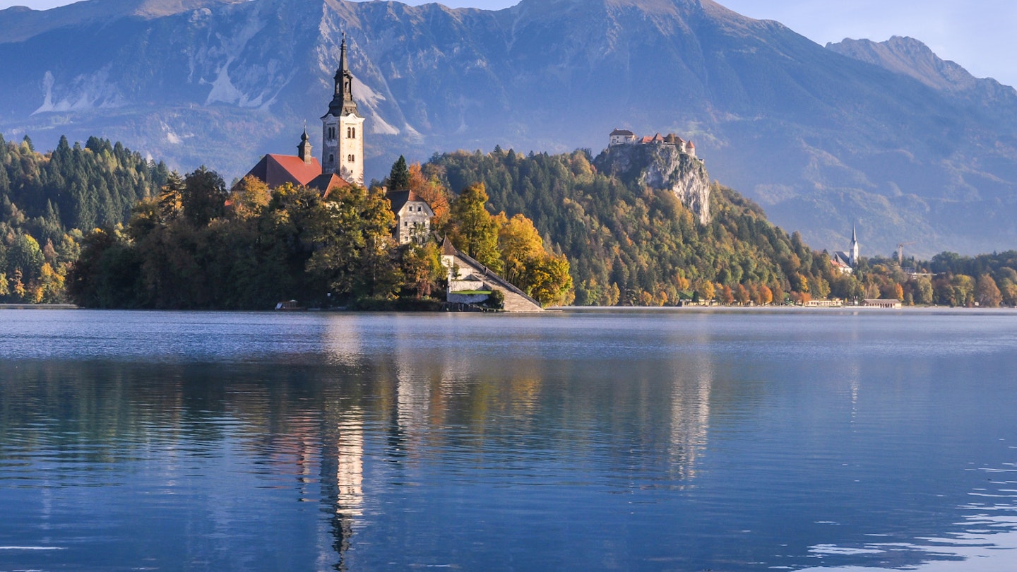 Church of the Assumption on Bled Island, with Bled Castle in the background