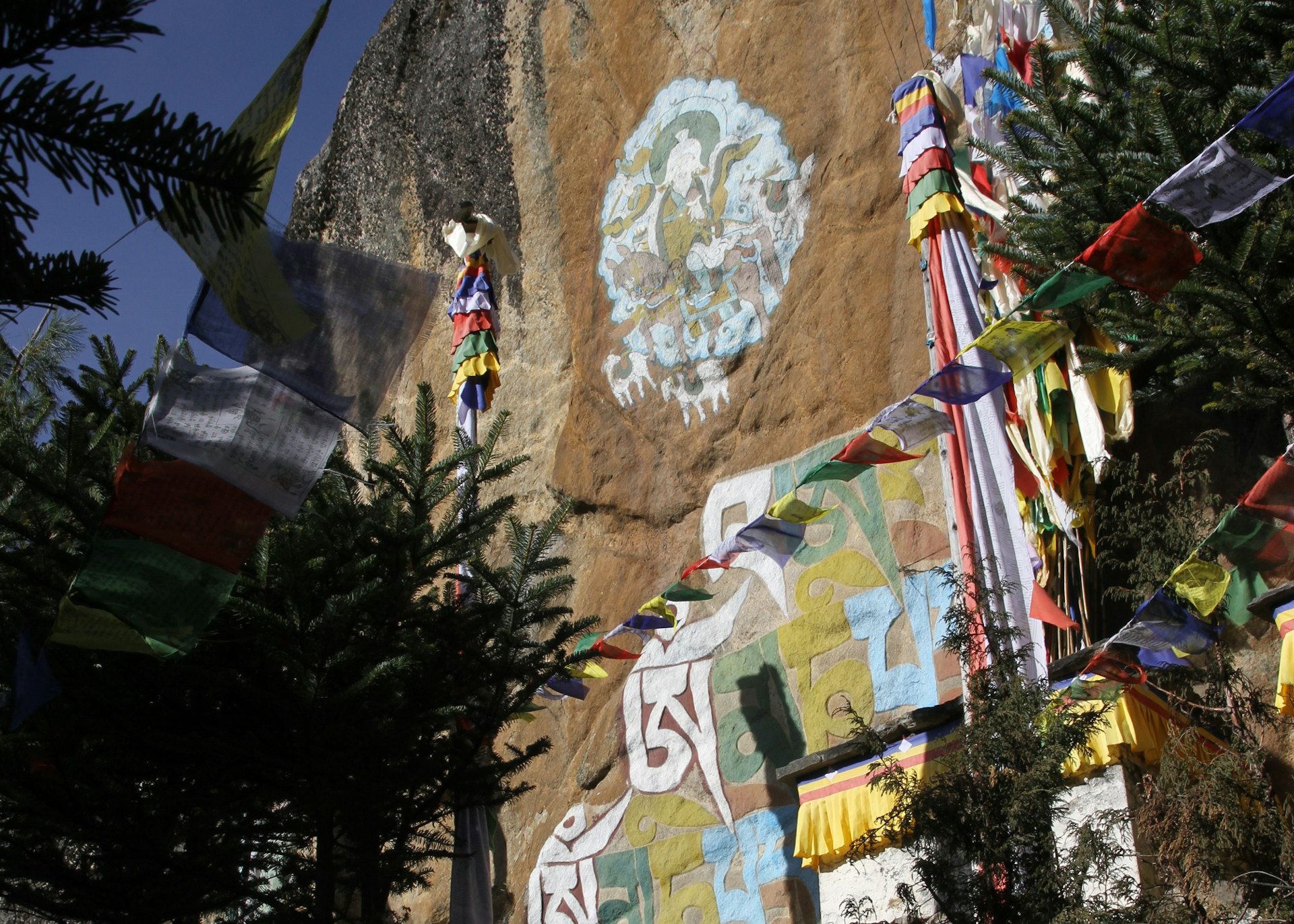 Buddhist rock paintings above Namche Bazaar. Image by Bradley Mayhew / Lonely Planet