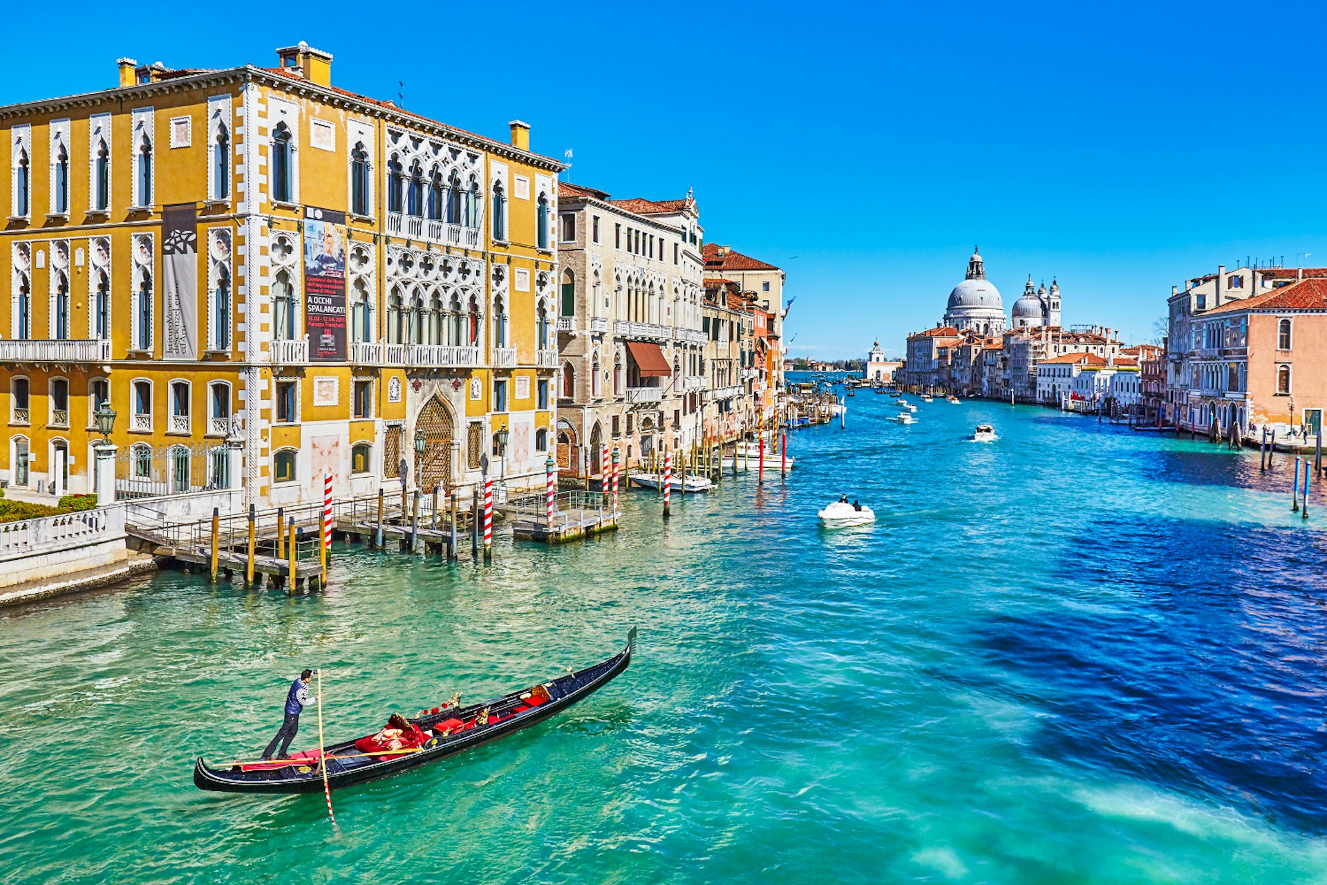 View along the Grand Canal, with Palazzo Franchetti on the left and Basilica di Santa Maria della Salute in the distance