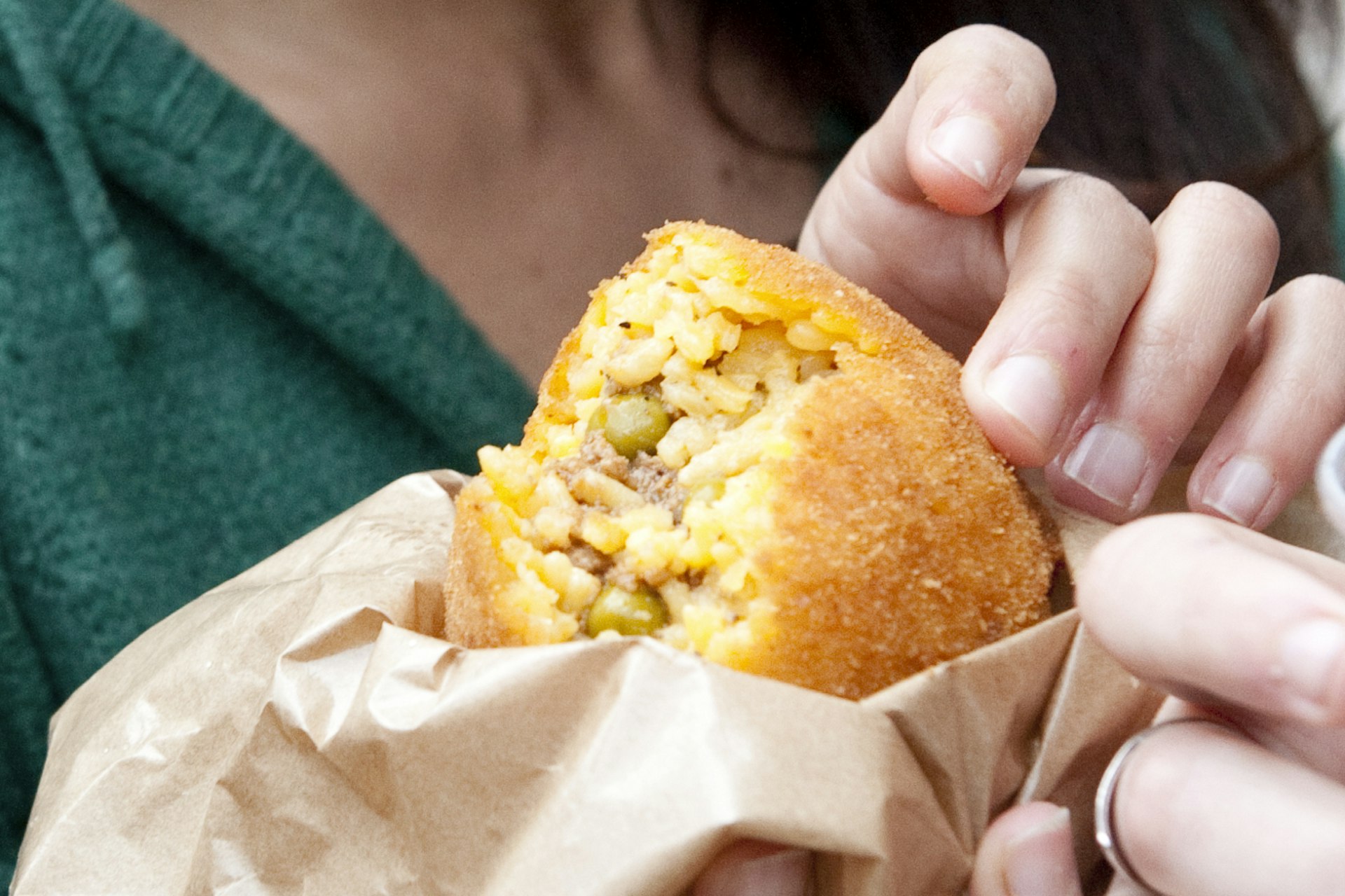 Delicious arancini filled rice ball.