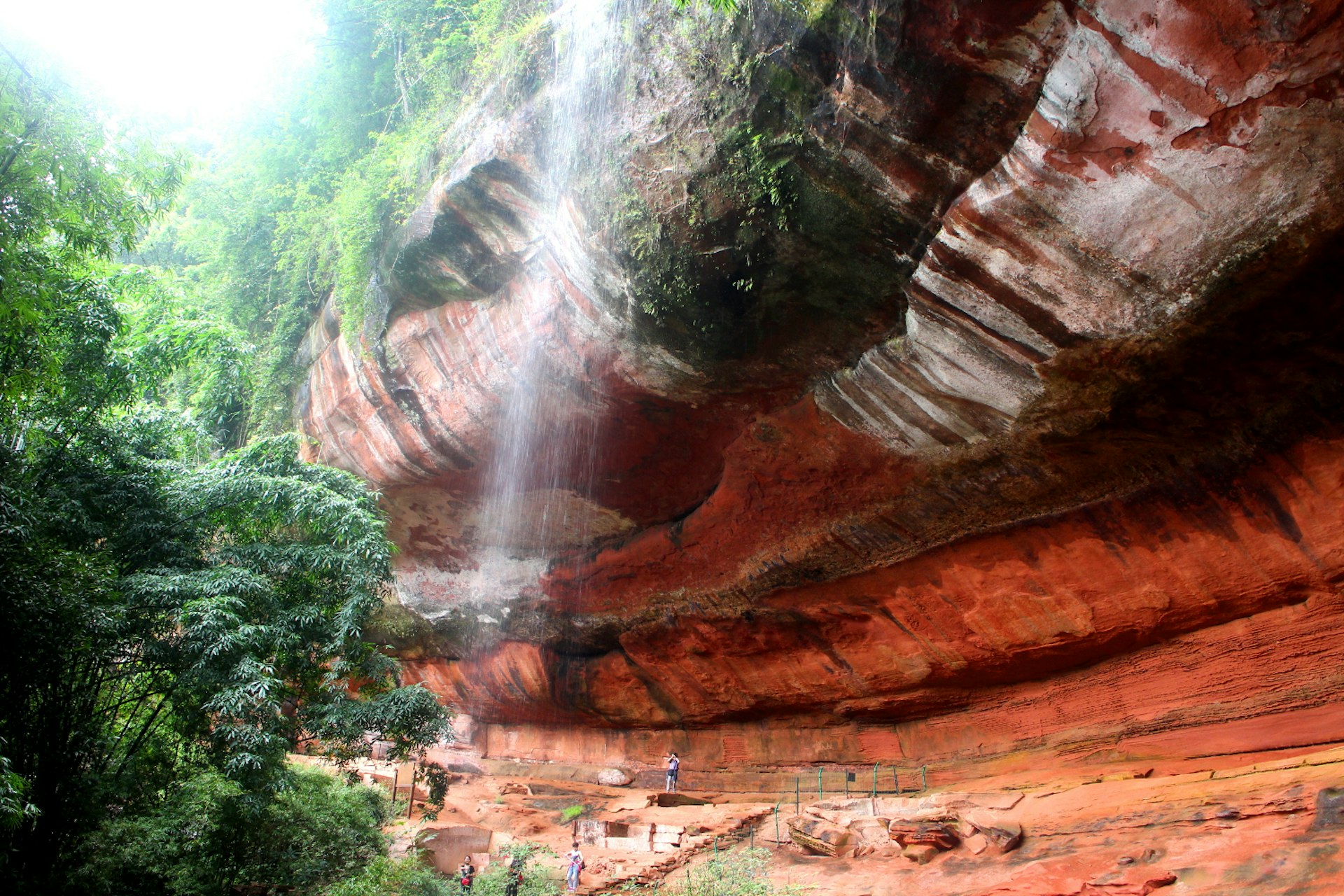 Red river runs through it: Chishui's iconic red clay waterfalls. Image by Thomas Bird / Lonely Planet