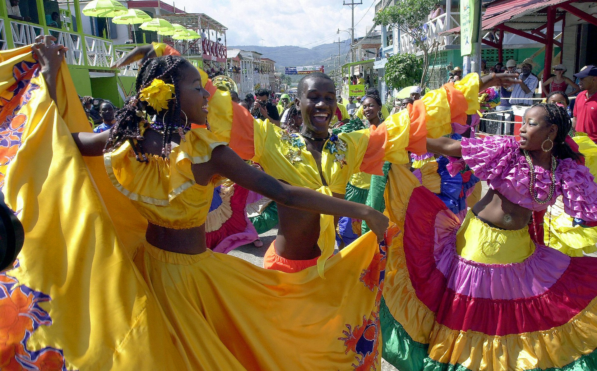 Haitians dance during the National Carnival in Jacmel. Image by © THONY BELIZAIRE / Getty Images