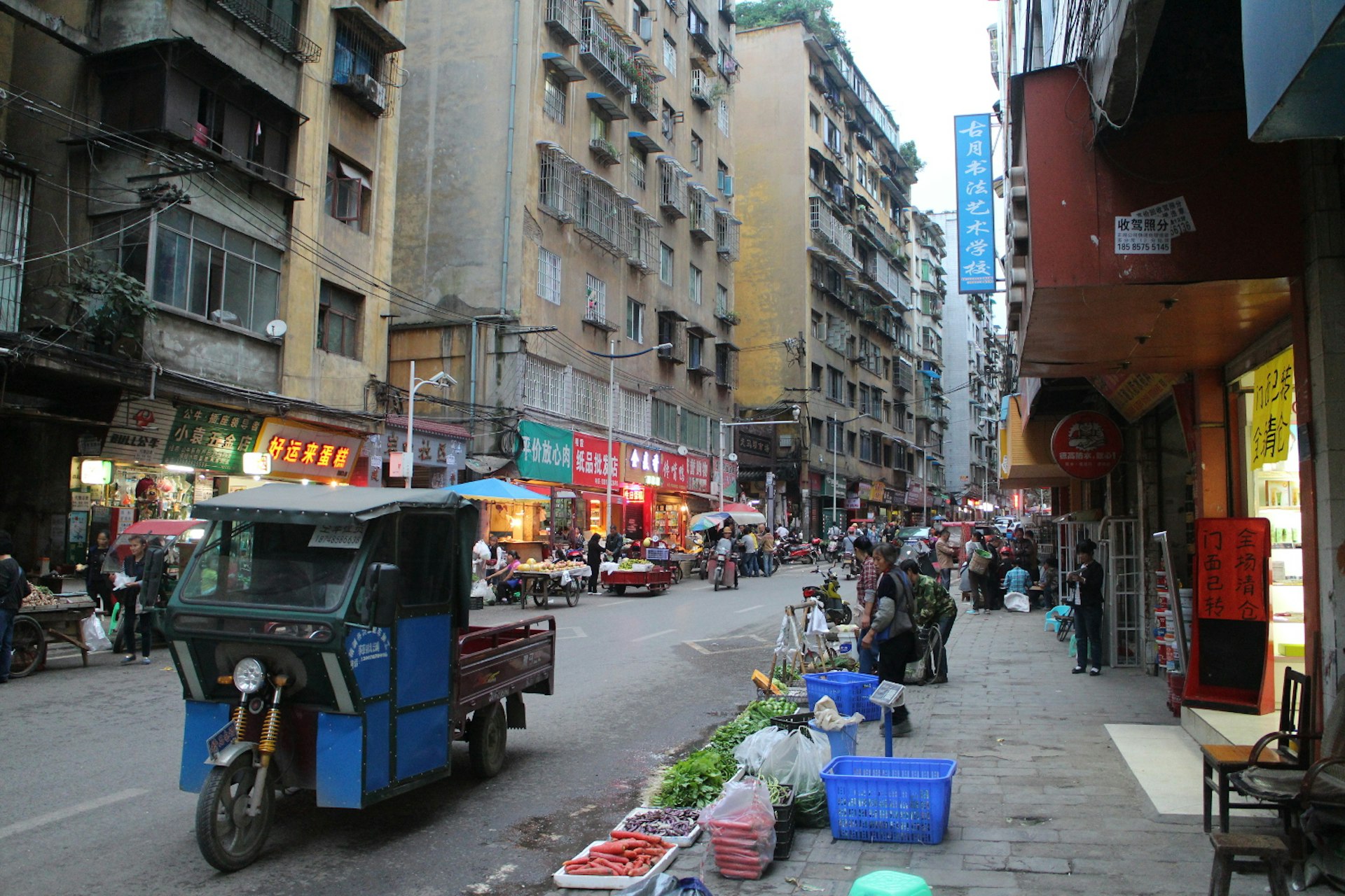 From from the revolution: busy market street of modern Zunyi. Image by Thomas Bird / Lonely Planet