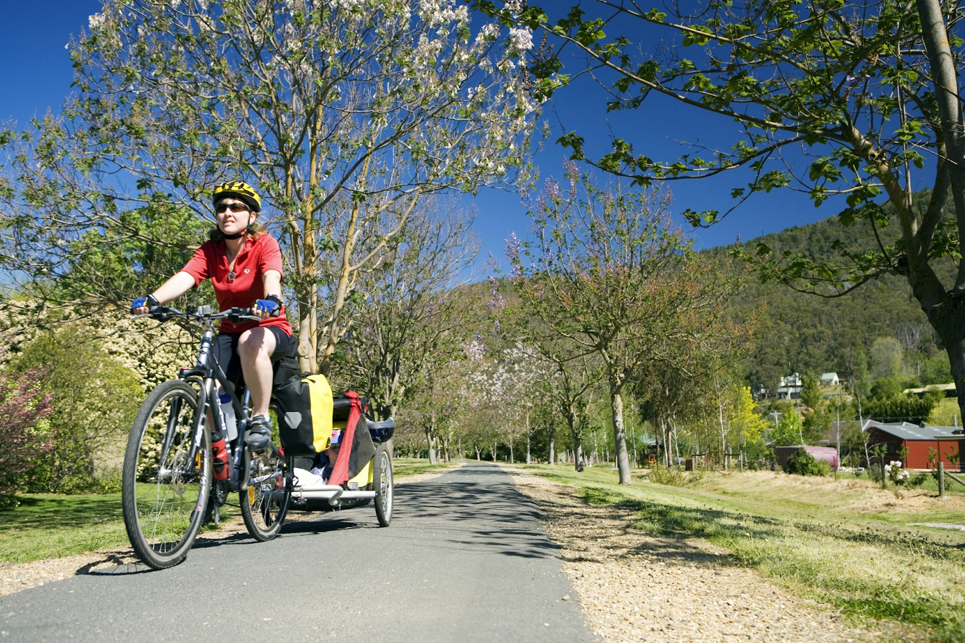 Rail trails make for family friendly cycling trips. © Andrew Bain / Getty Images