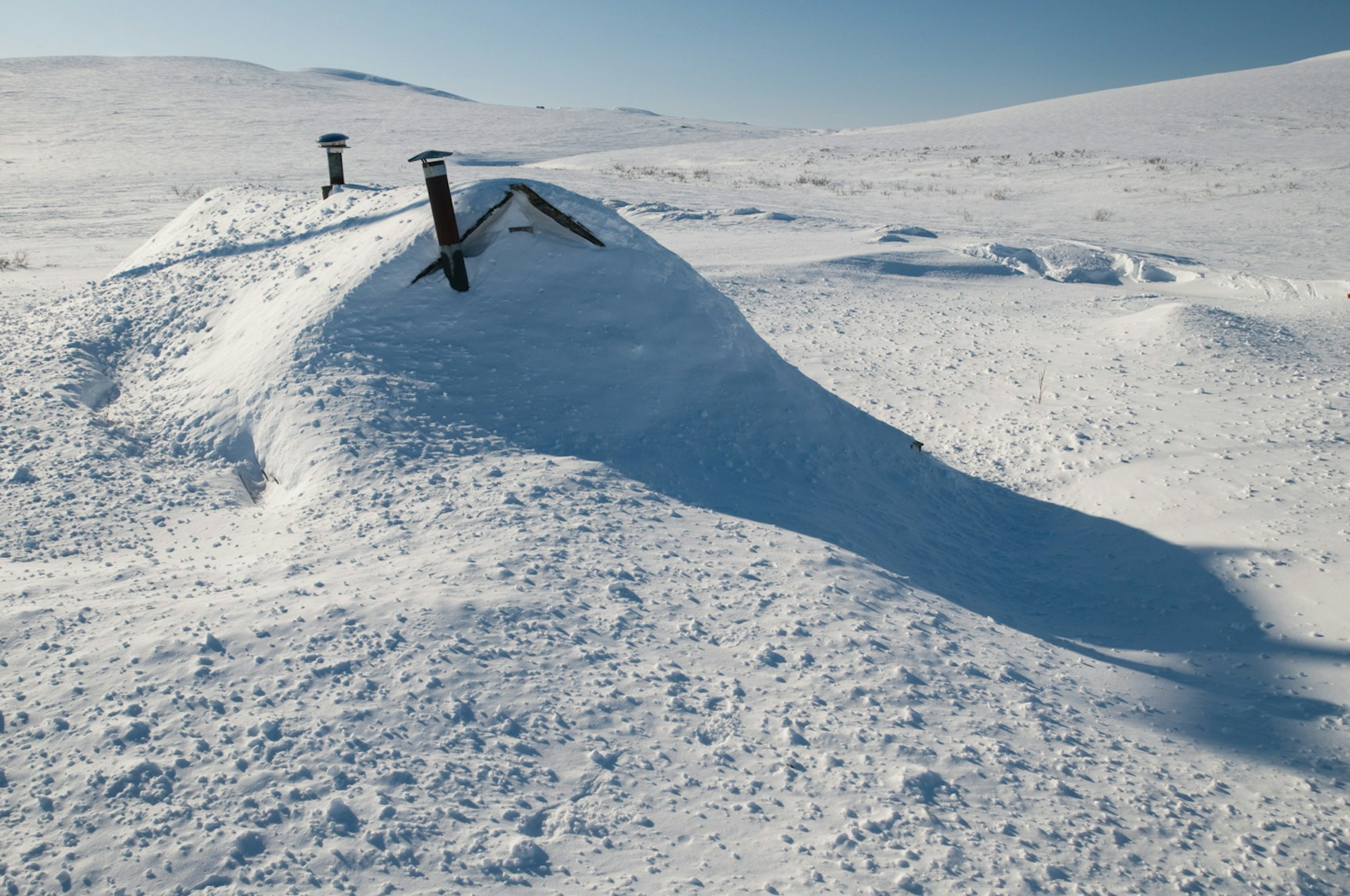 Subarctic Nome can see weather like this snowstorm that left a cabin buried to its stovepipes © Daryl Pederson / Design Pics / Getty
