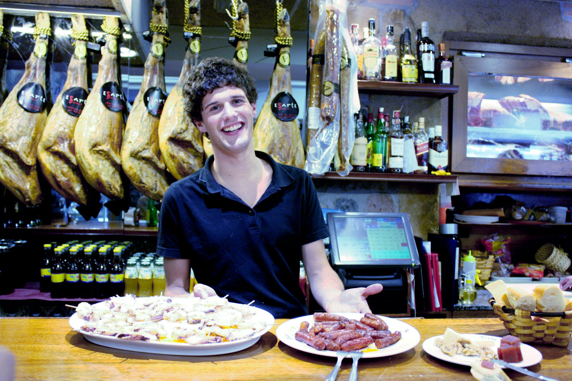 Pintxos served with a smile at © Lorna Parkes / Lonely Planet