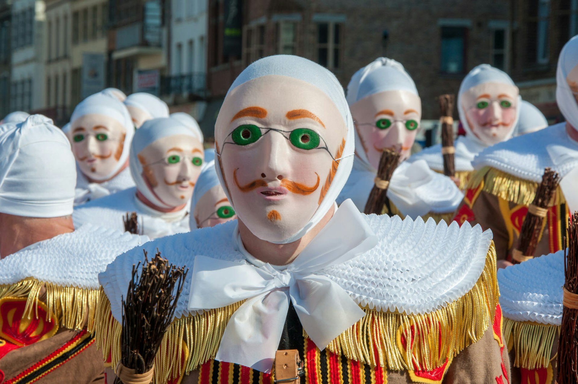 Revellers in the traditional Gilles costume at the Carnaval de Binche