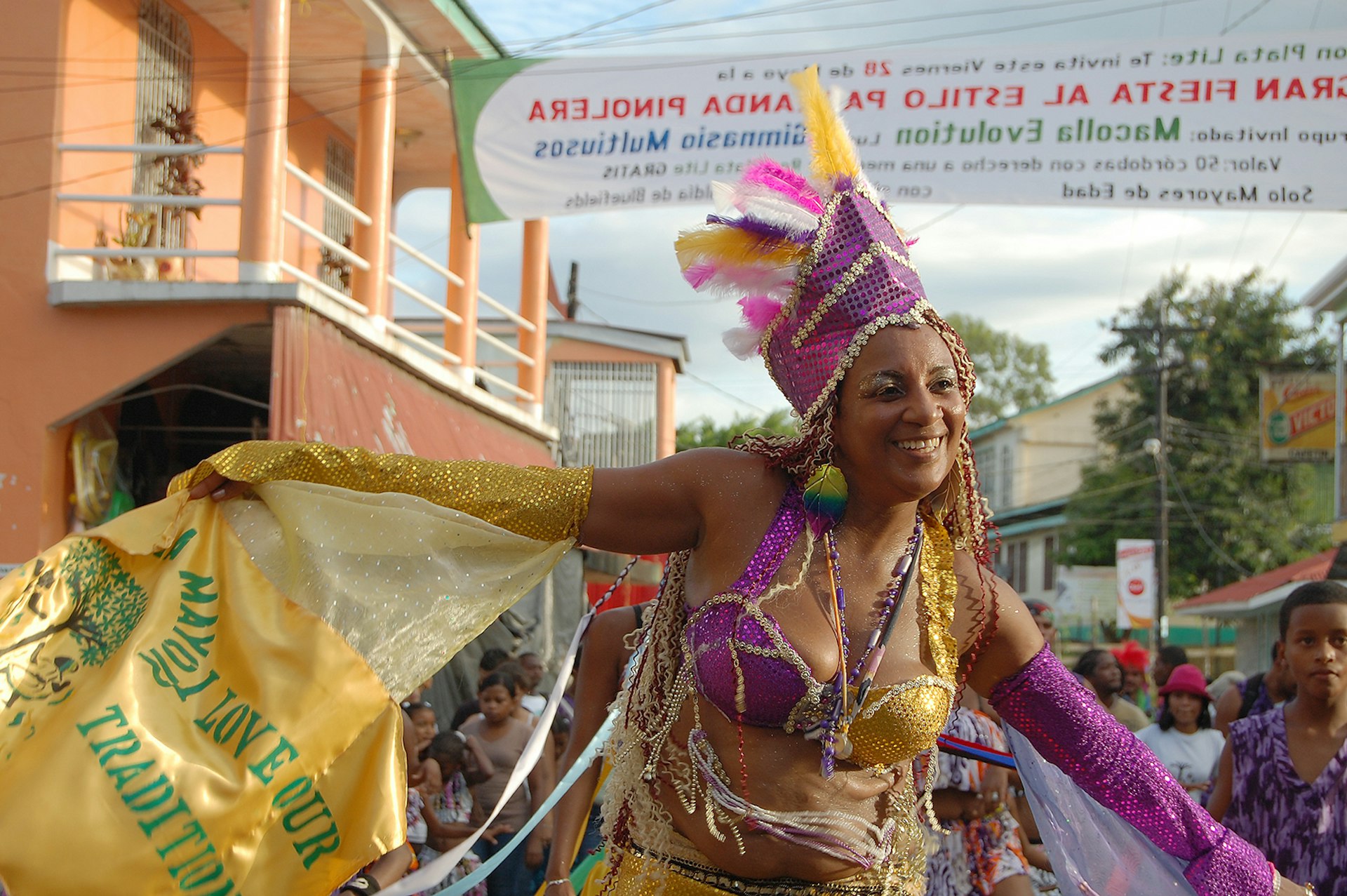 A Palo de Mayo reveler smiles during a street parade © Alex Egerton / Lonely Planet