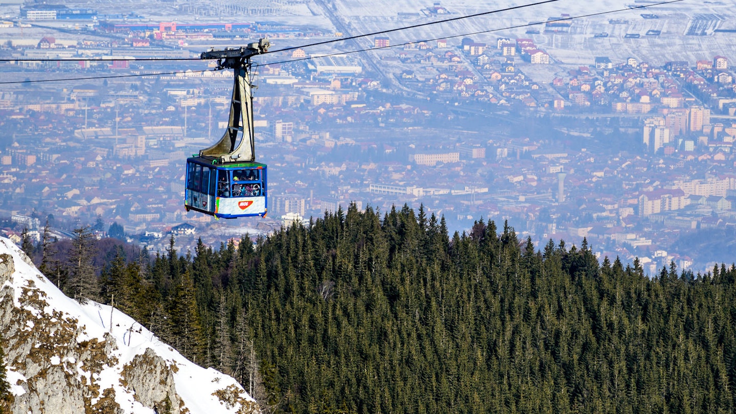 View over Brasov from the gondola at Poiana Brasov ski resort Emi Cristea/ Shutterstock