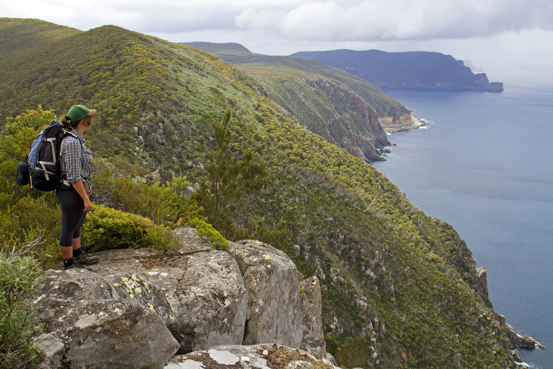 Hiker on Arthurs Peak along the Three Capes Track © Andrew Bain / Lonely Planet