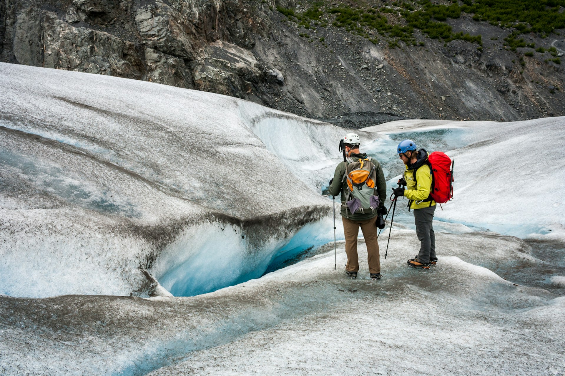 Examining a crevasse © Alexander Howard / Lonely Planet