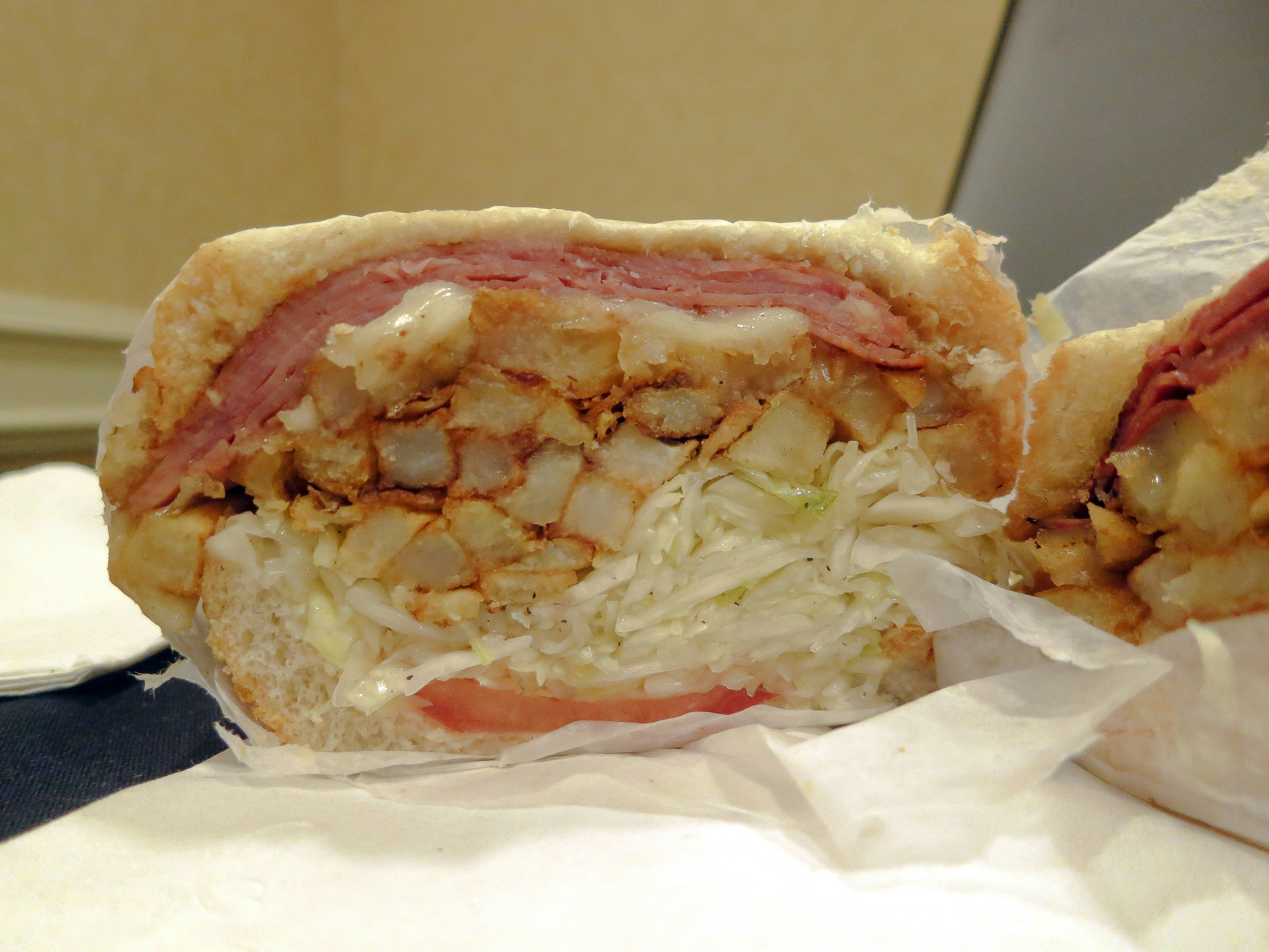 A true Pittsburgh original, this Primanti Brothers sandwich is stuffed with slaw and french fries. 