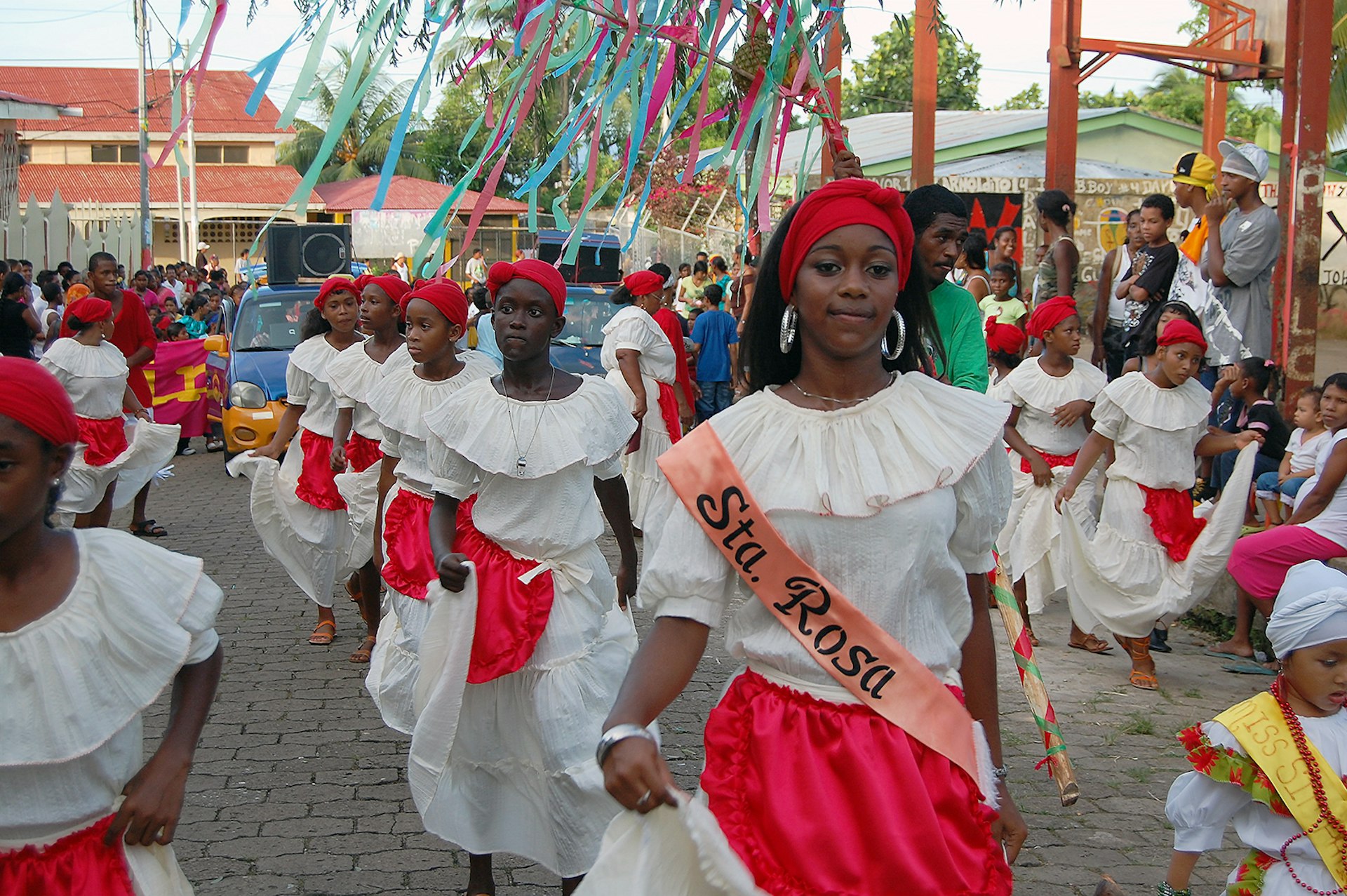 A neighborhood dance troupe makes their way through the streets of Bluefields © Alex Egerton / Lonely Planet