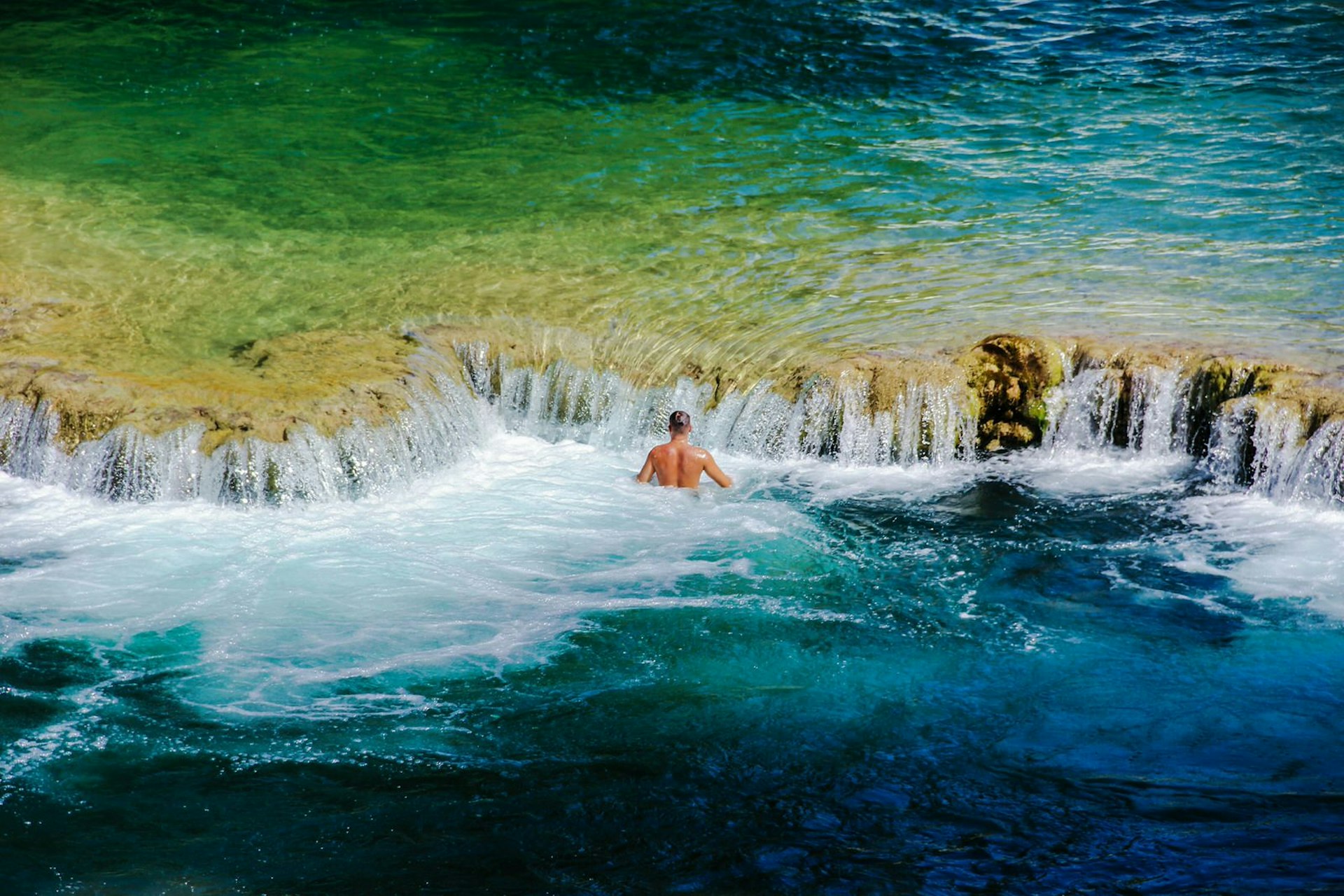 Cooling off in one of Krka National Park's many waterfalls