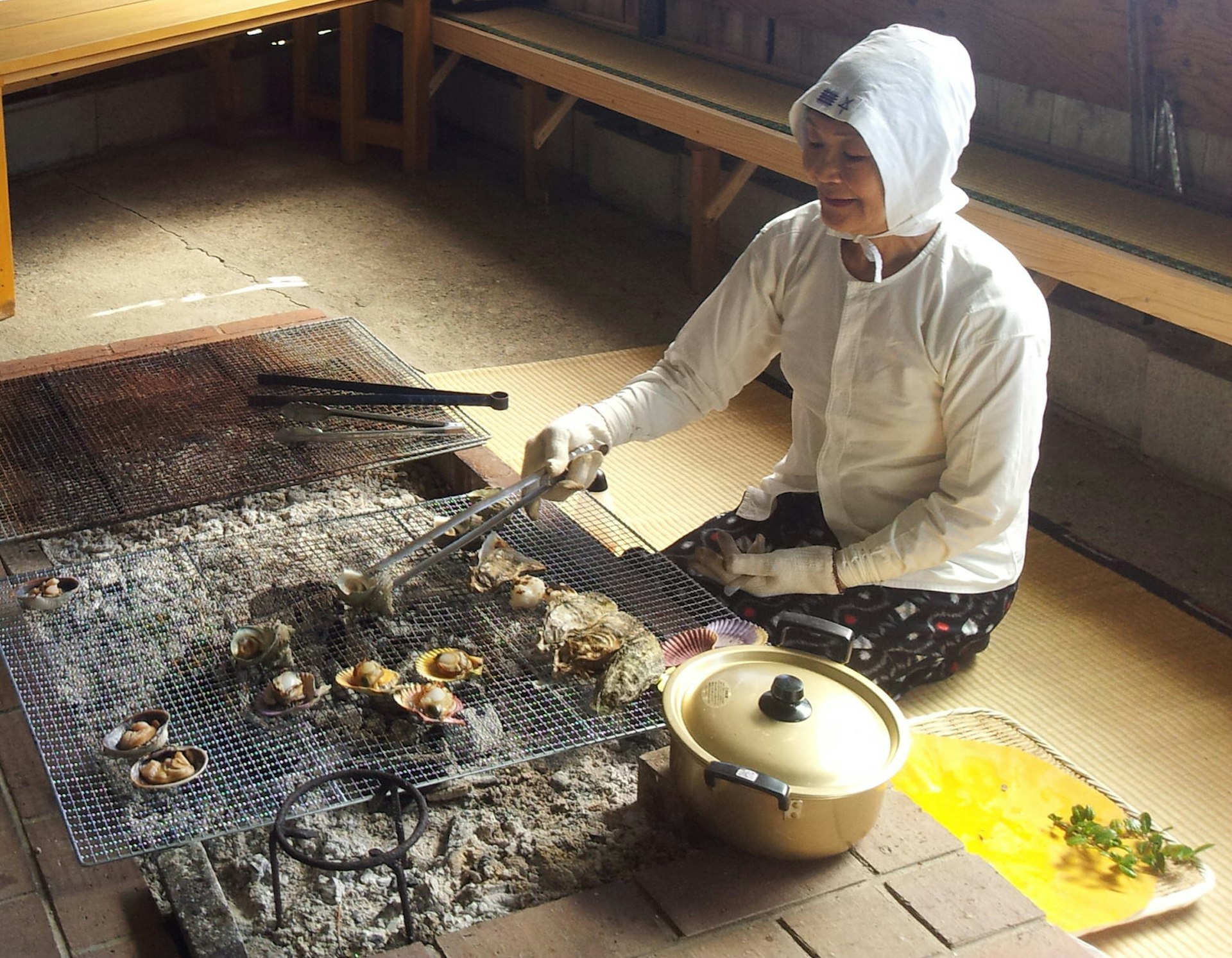 Ama grilling seafood in Ōsatsu