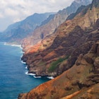 The rugged shoreline of the Na Pali Coast in Kauai © Alexander Howard / Lonely Planet