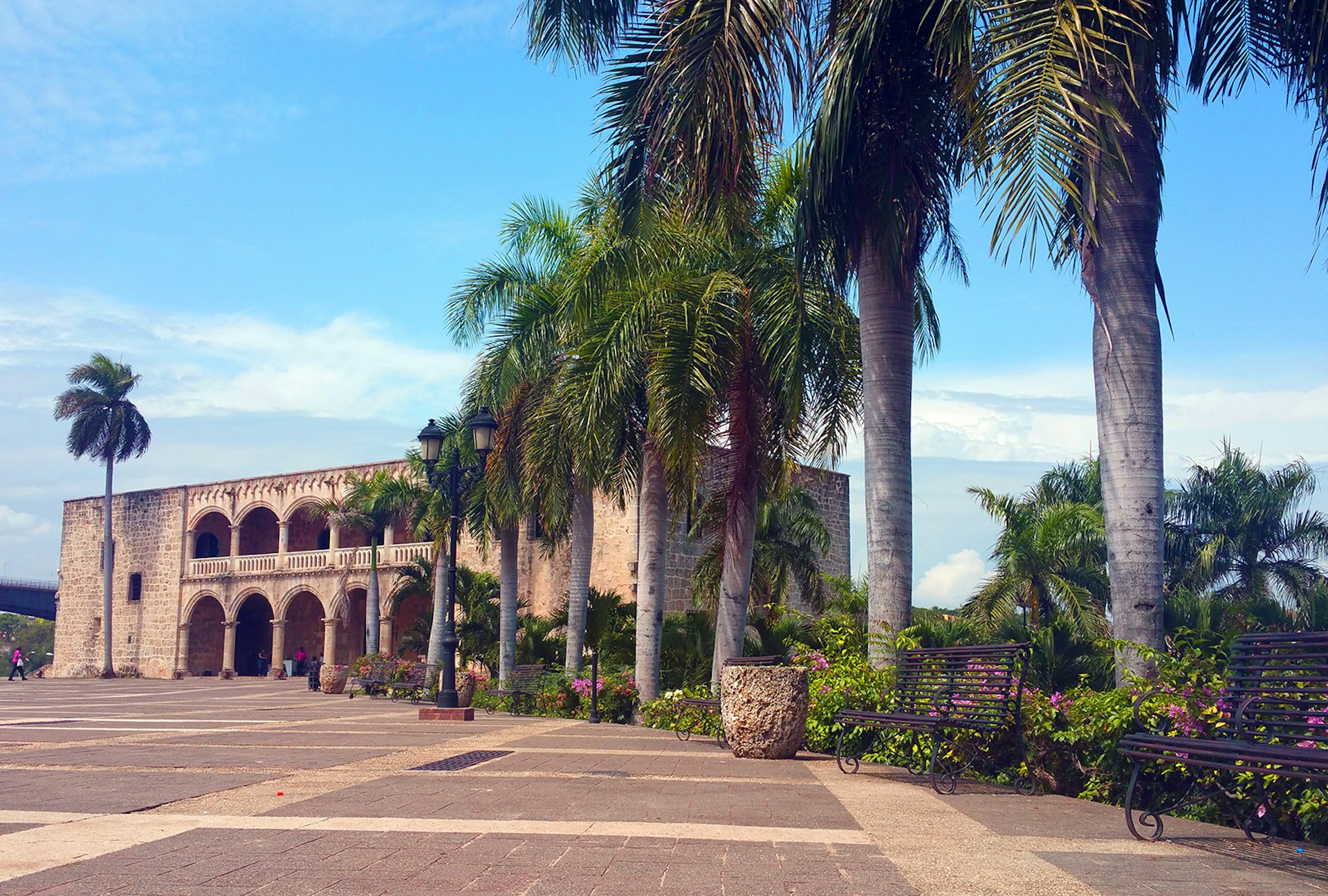 A row of palm trees stand next to the Alcázar de Colón, the residence of Christopher Columbus' son, located off of the Plaza de España. The Dominican Republic has more to offer than beaches. 
