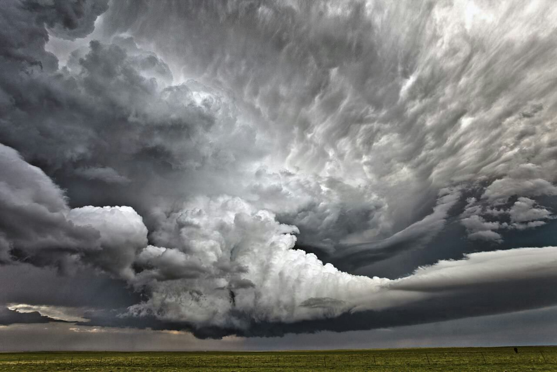 *** EXCLUSIVE *** COLORADO, USA - JUNE 4: Brian, the photographer snaps an elaborate storm cloud formation on June 4, 2015 in Colorado, USA. FEARLESS photographer has dedicated his life to chasing storms after a tornado almost killed him on the way to his high school prom in 1993. Kansas native Brian Barnes, 39, was raised in the beating heart of North America's 'Tornado Alley' - and was also struck by lightning as a teenager. Taken by tour guide Brian in Colorado, these incredible pictures show giant supercell storms - one of the most powerful weather formations found over land. Also known as rotating thunderstorms, supercells can produce winds over 100mph and can uproot trees and obliterate buildings. Brian, who runs an extreme weather tour company, captured these images in June 2015, and was intimately acquainted with ferocious storms from a young age. PHOTOGRAPH BY Brian Barnes / Barcroft Media UK Office, London. T +44 845 370 2233 W www.barcroftmedia.com USA Office, New York City. T +1 212 796 2458 W www.barcroftusa.com Indian Office, Delhi. T +91 11 4053 2429 W www.barcroftindia.com (Photo credit should read Brian Barnes / Barcroft Media / Barcroft Media via Getty Images)